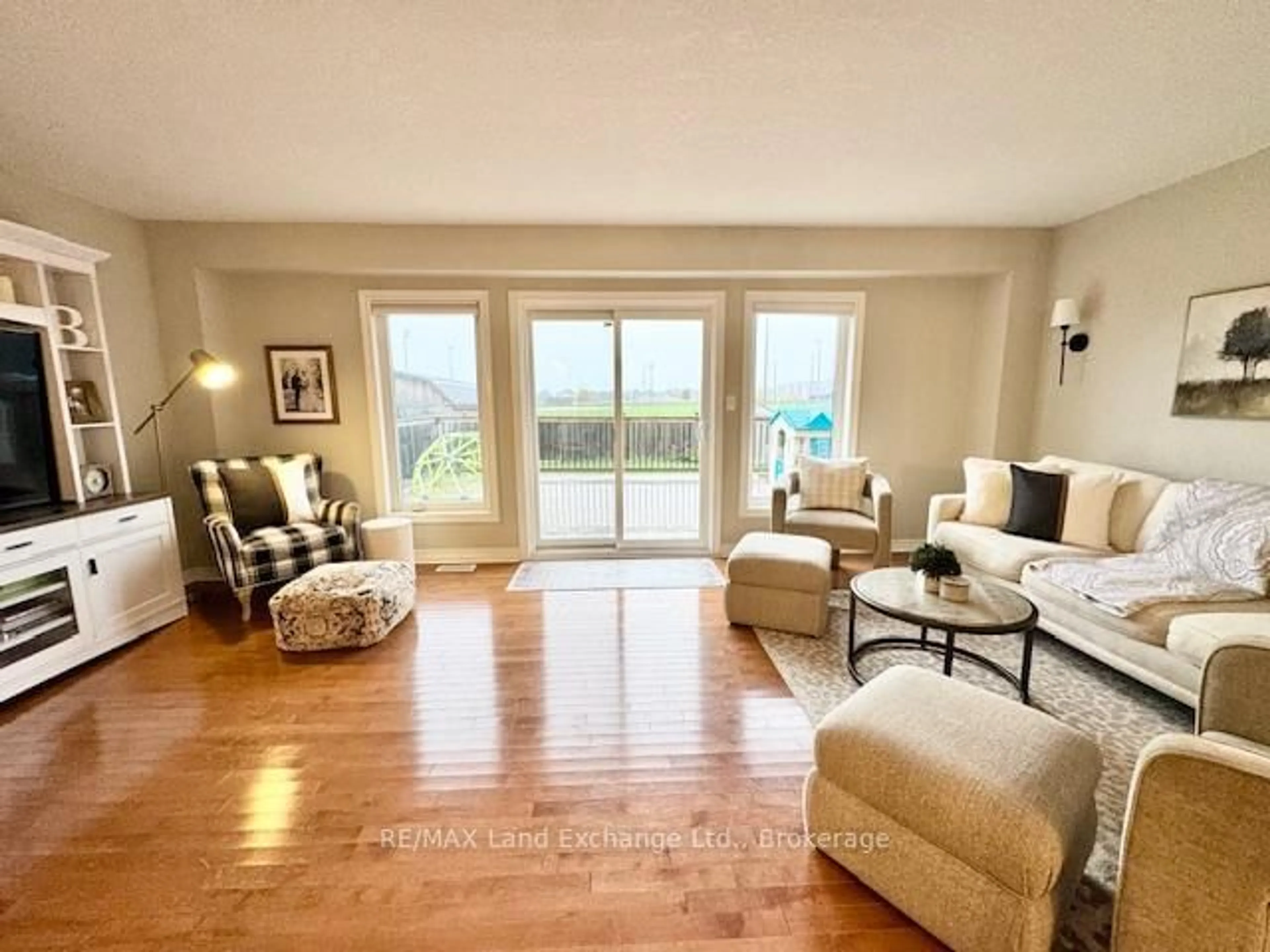 Living room with furniture, wood/laminate floor for 451 Joseph St, Saugeen Shores Ontario N0H 2C2