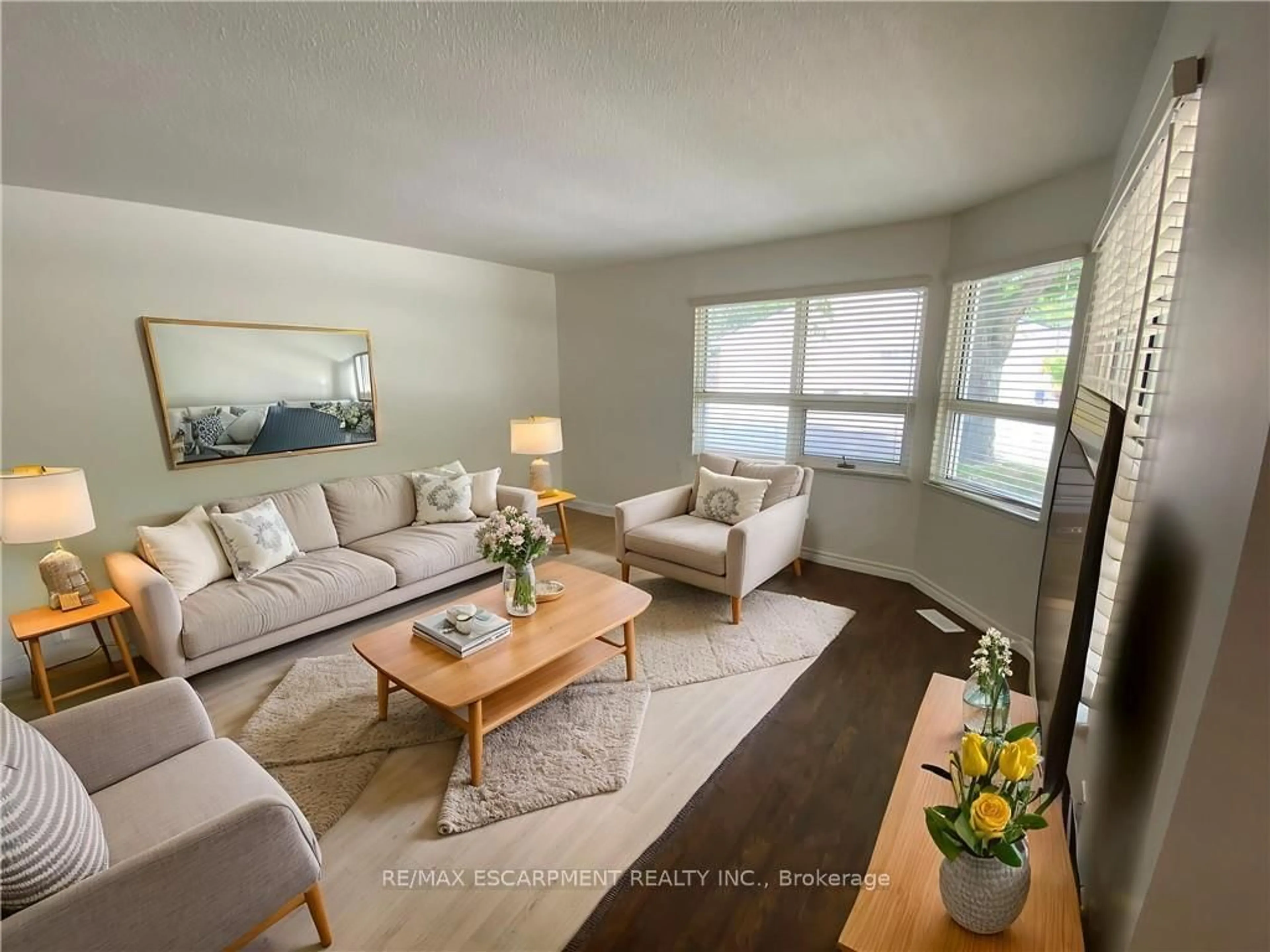 Living room with furniture, wood/laminate floor for 1 Szollosy Circ, Hamilton Ontario L9B 1T8