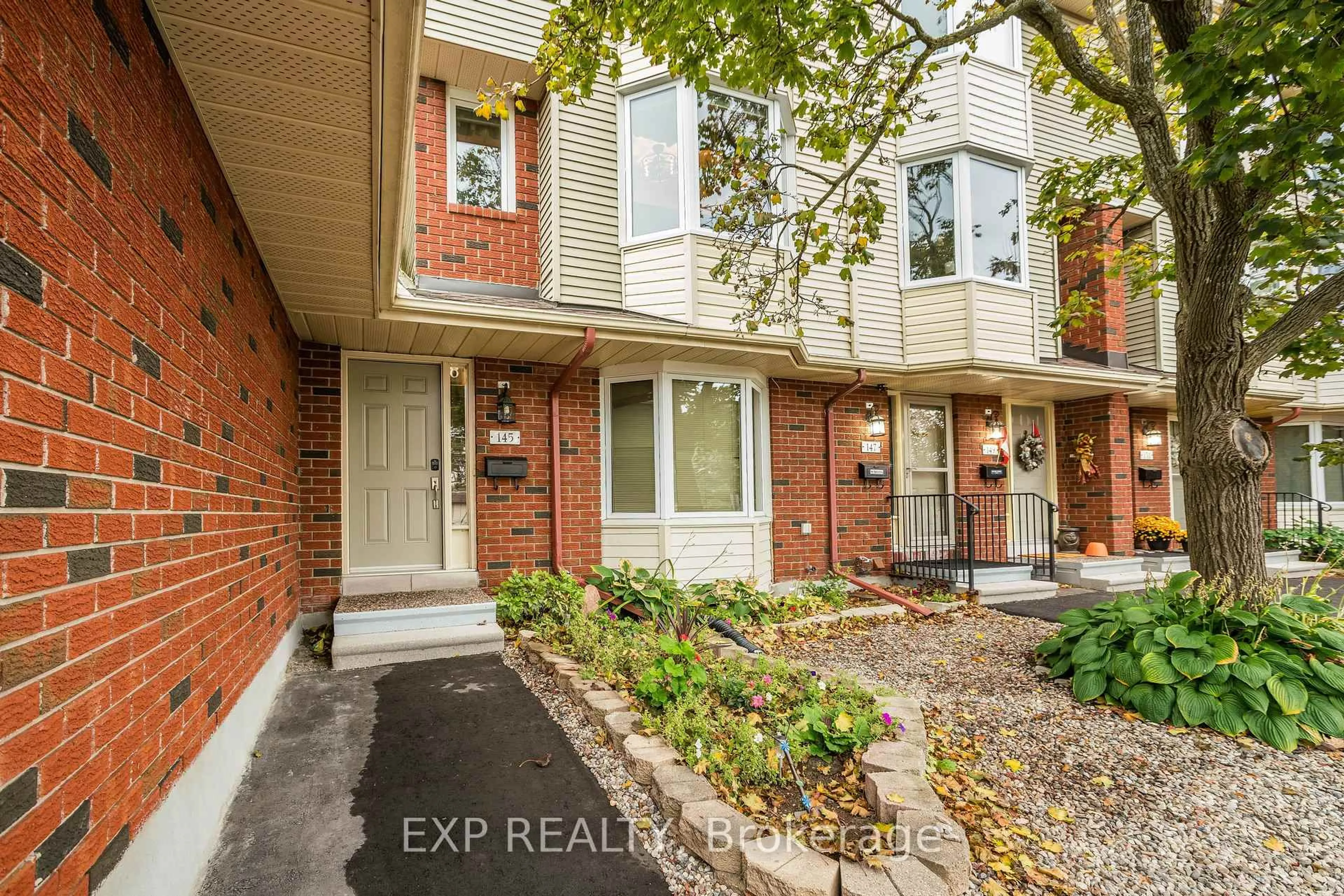 Home with brick exterior material, street for 145 Rushford Private, Ottawa Ontario K1T 3C7