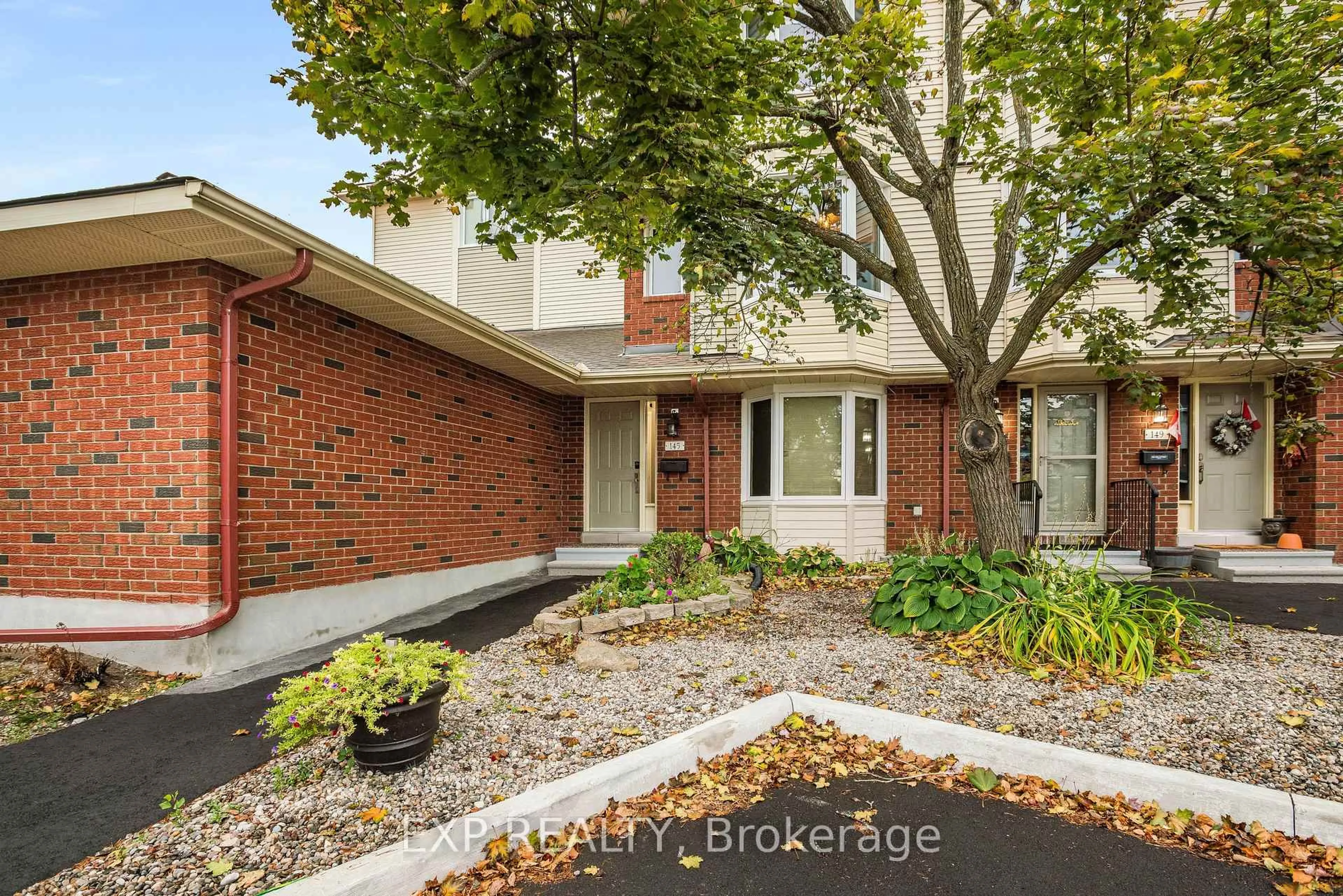 Home with brick exterior material, street for 145 Rushford Private, Ottawa Ontario K1T 3C7