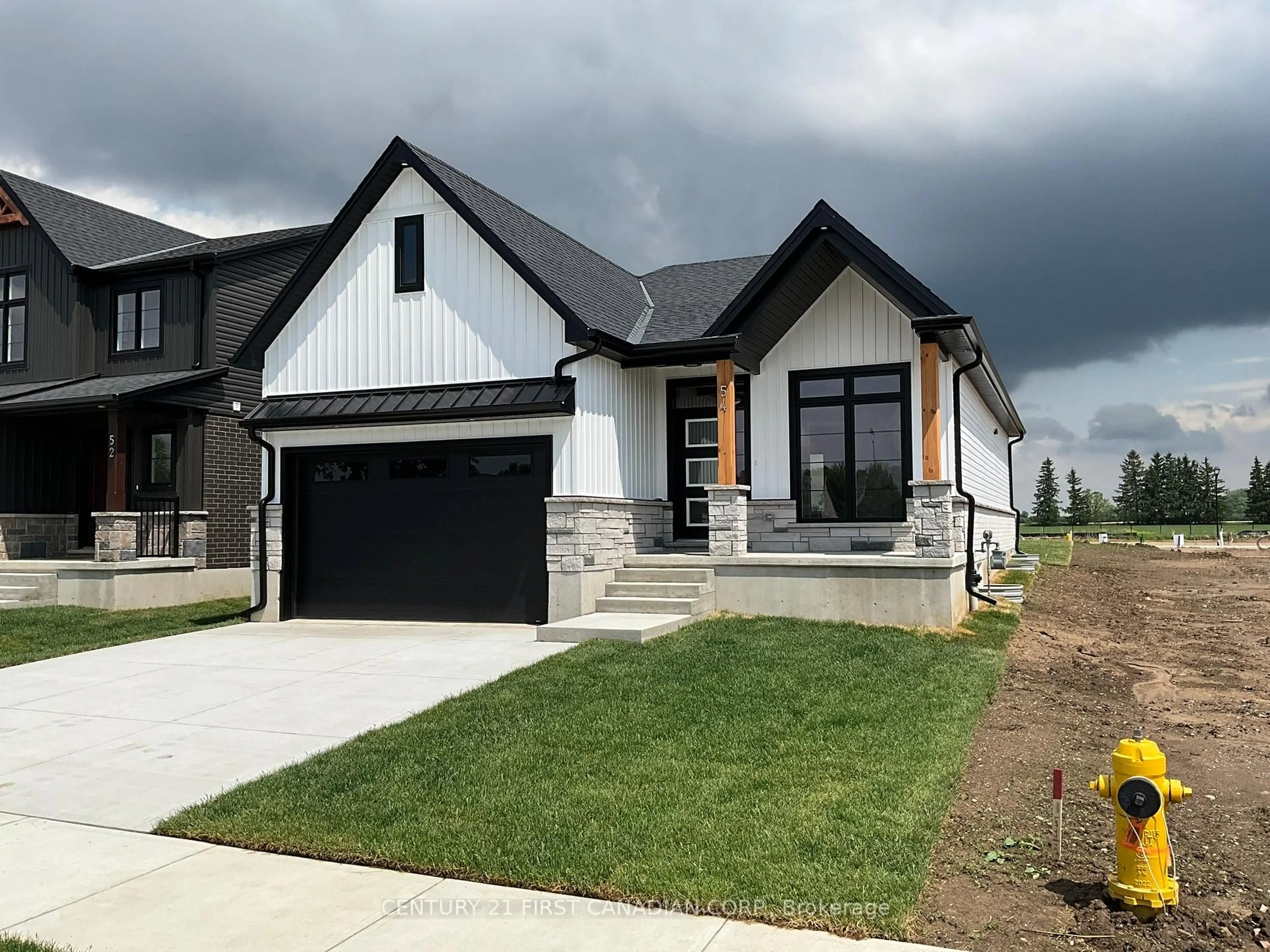 Home with brick exterior material, street for 56 POSTMA Cres, North Middlesex Ontario N0M 1A0