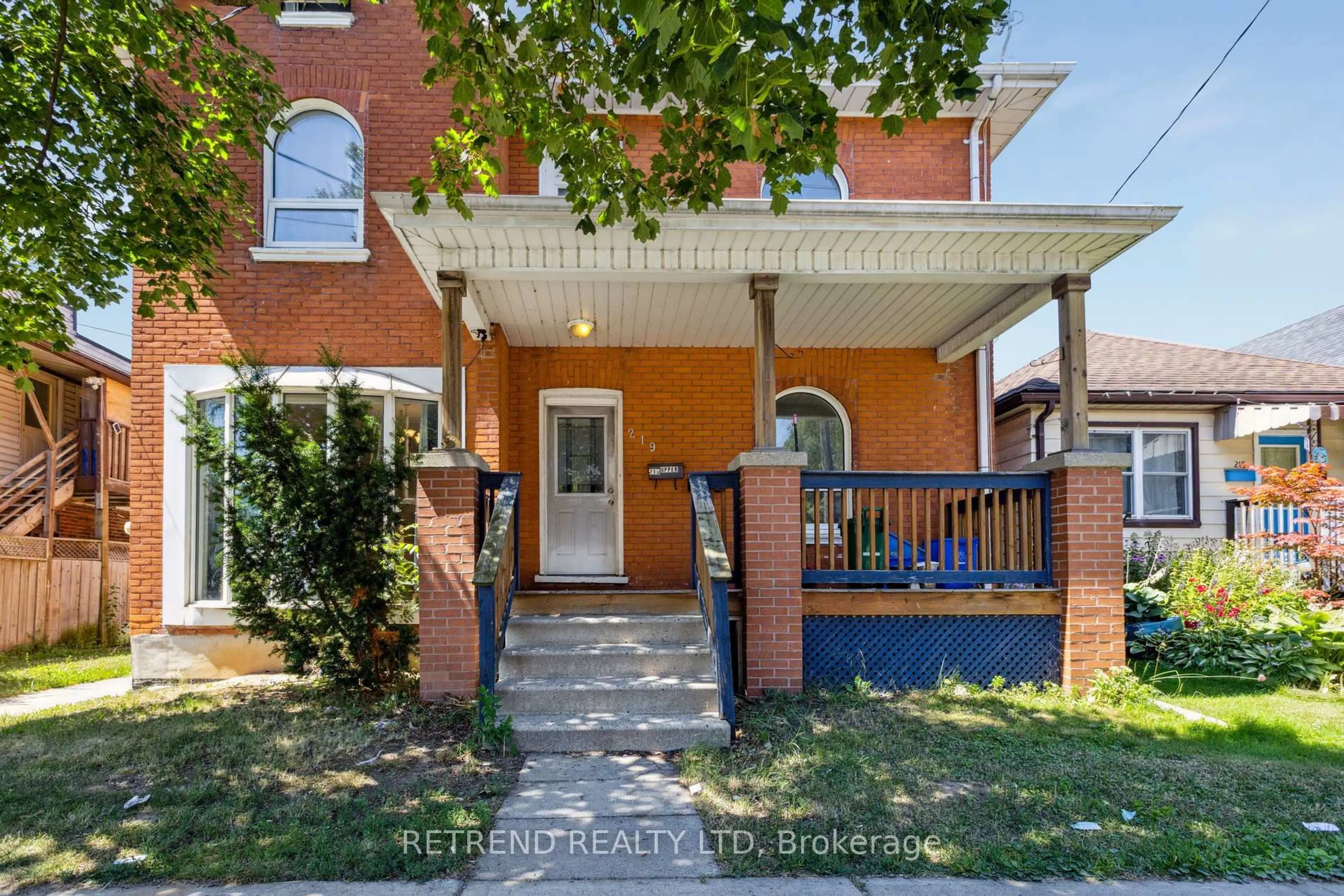 Home with brick exterior material, street for 219 Erie Ave, Brantford Ontario N3S 2H1