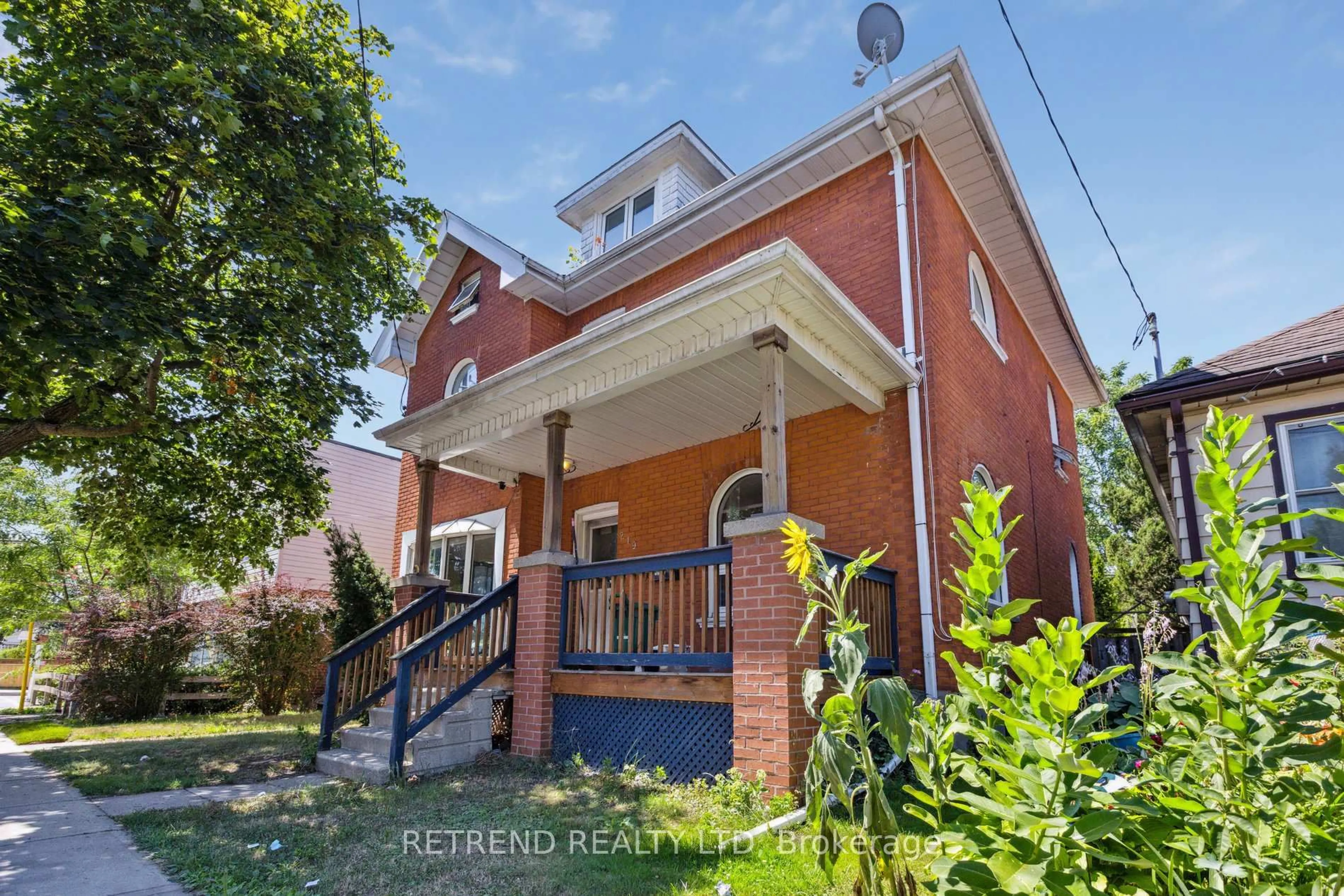 Home with brick exterior material, street for 219 Erie Ave, Brantford Ontario N3S 2H1