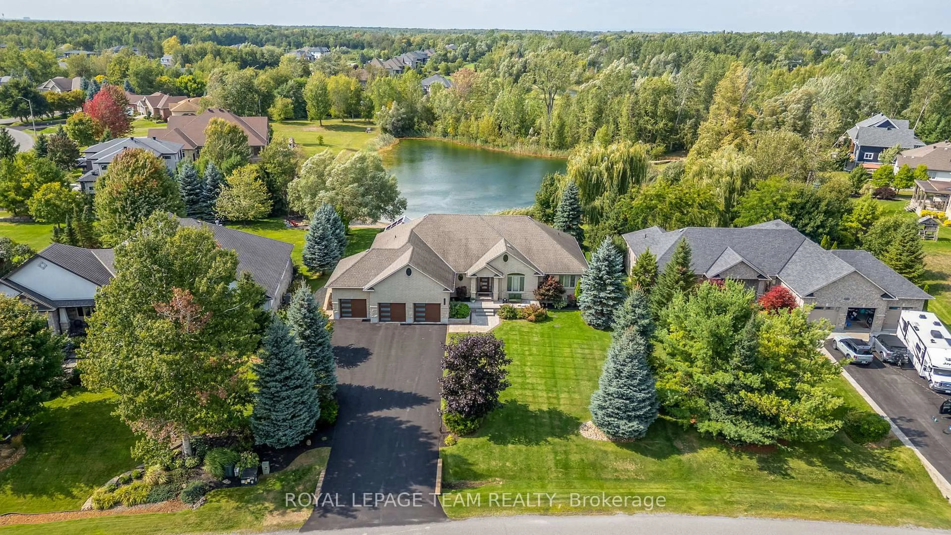 A pic from outside/outdoor area/front of a property/back of a property/a pic from drone, water/lake/river/ocean view for 6903 Lake Forest Walk, Greely Ontario K4P 1R7
