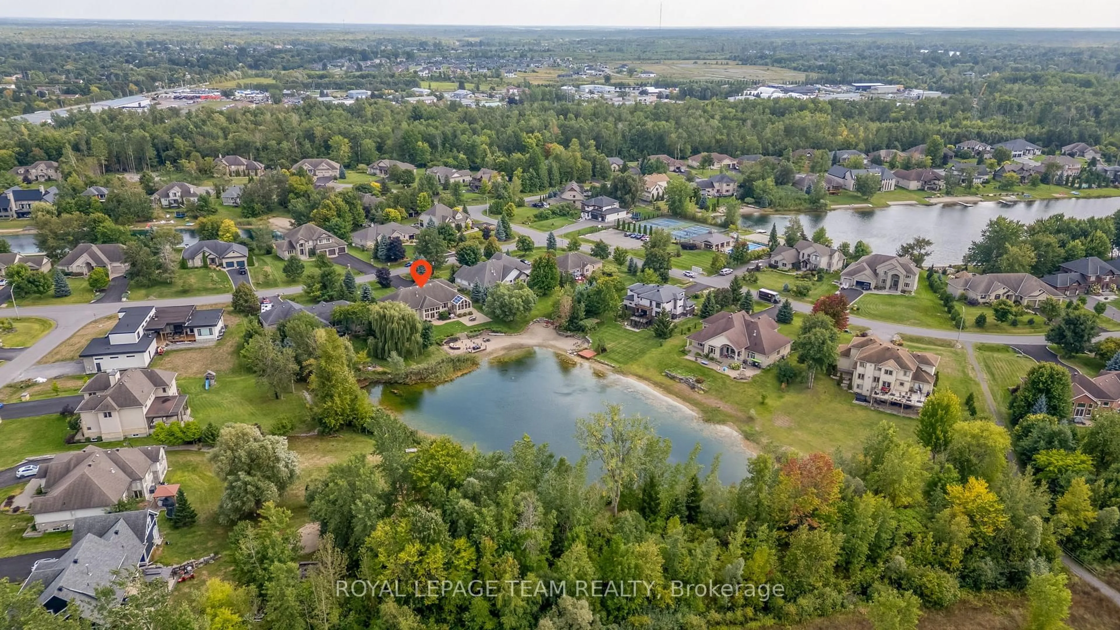 A pic from outside/outdoor area/front of a property/back of a property/a pic from drone, water/lake/river/ocean view for 6903 Lake Forest Walk, Greely Ontario K4P 1R7