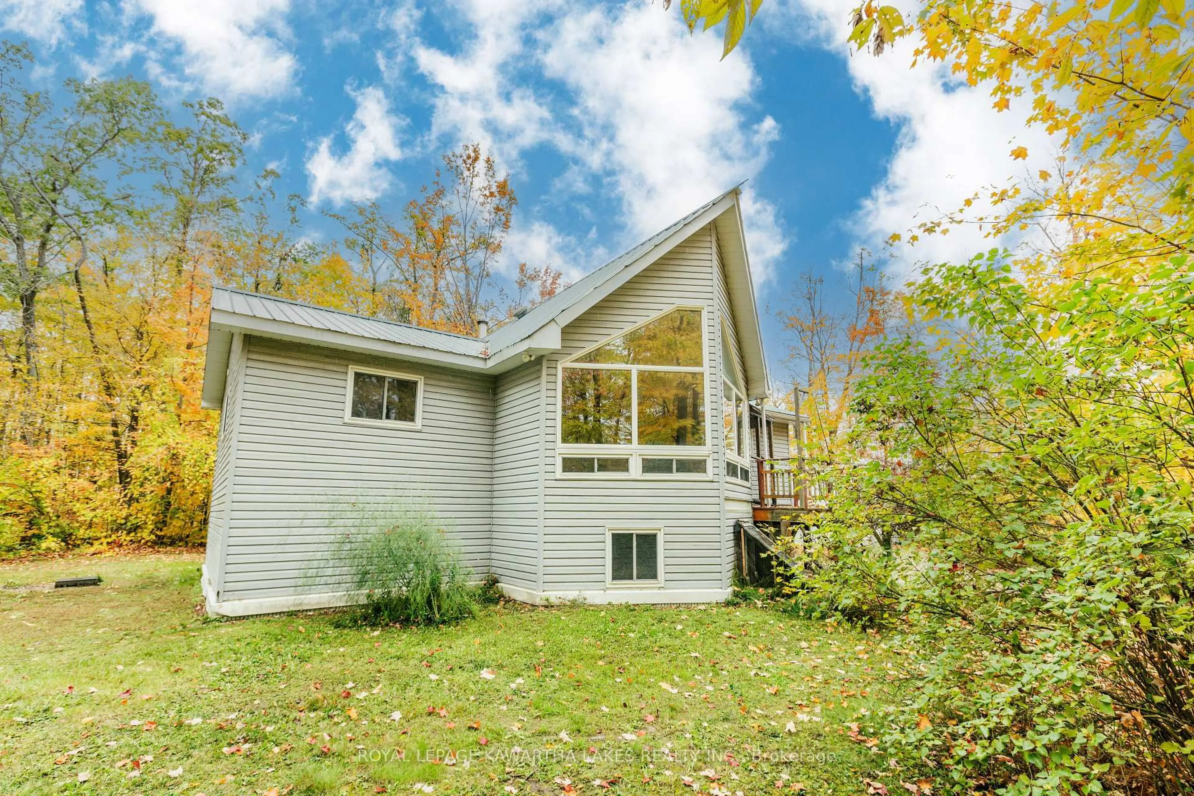 Home with vinyl exterior material, water/lake/river/ocean view for 693 Balsam Lake Dr, Kawartha Lakes Ontario K0M 2B0