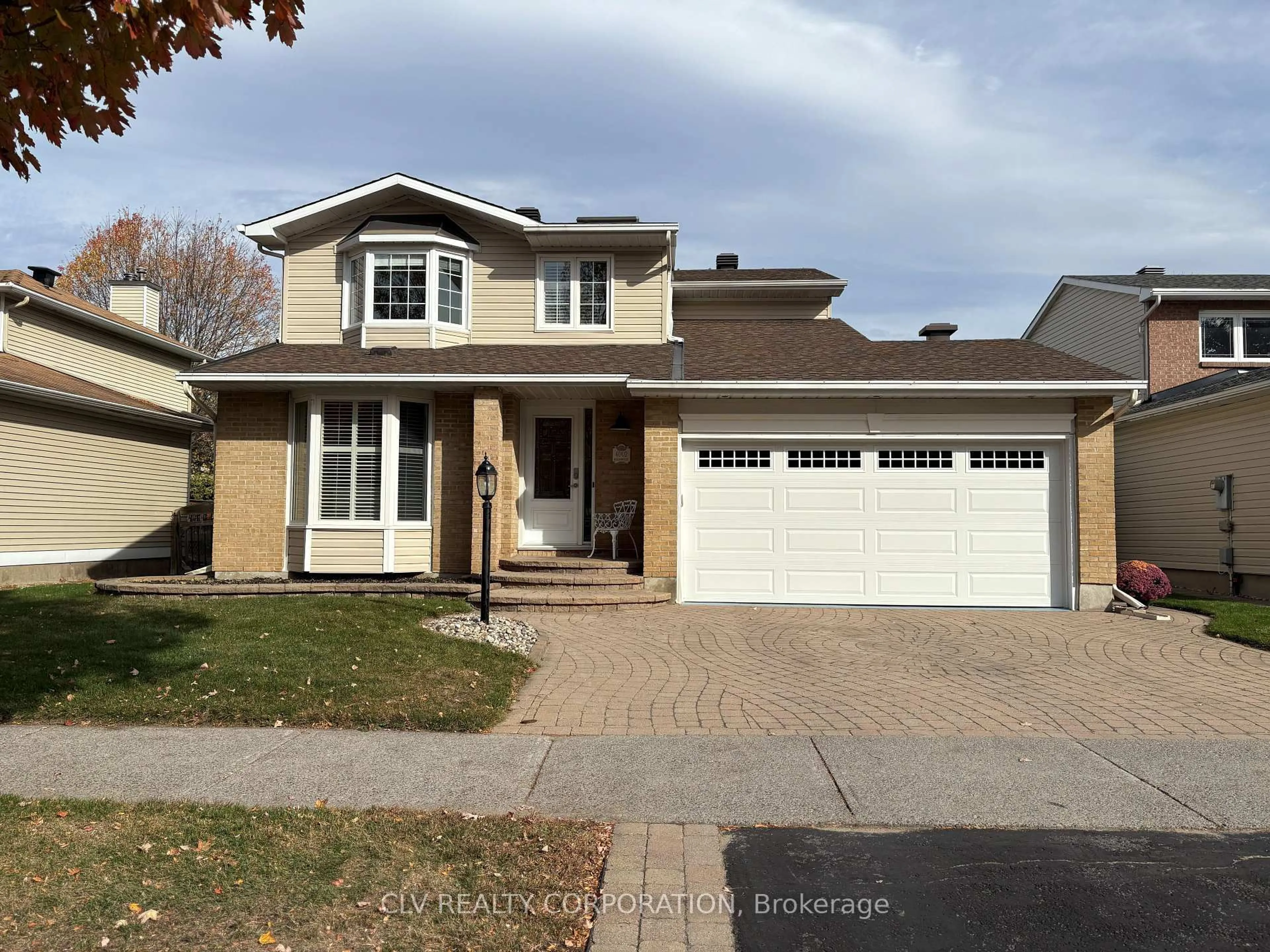 Home with vinyl exterior material, street for 6002 Meadowglen Dr, Ottawa Ontario K1C 5T3