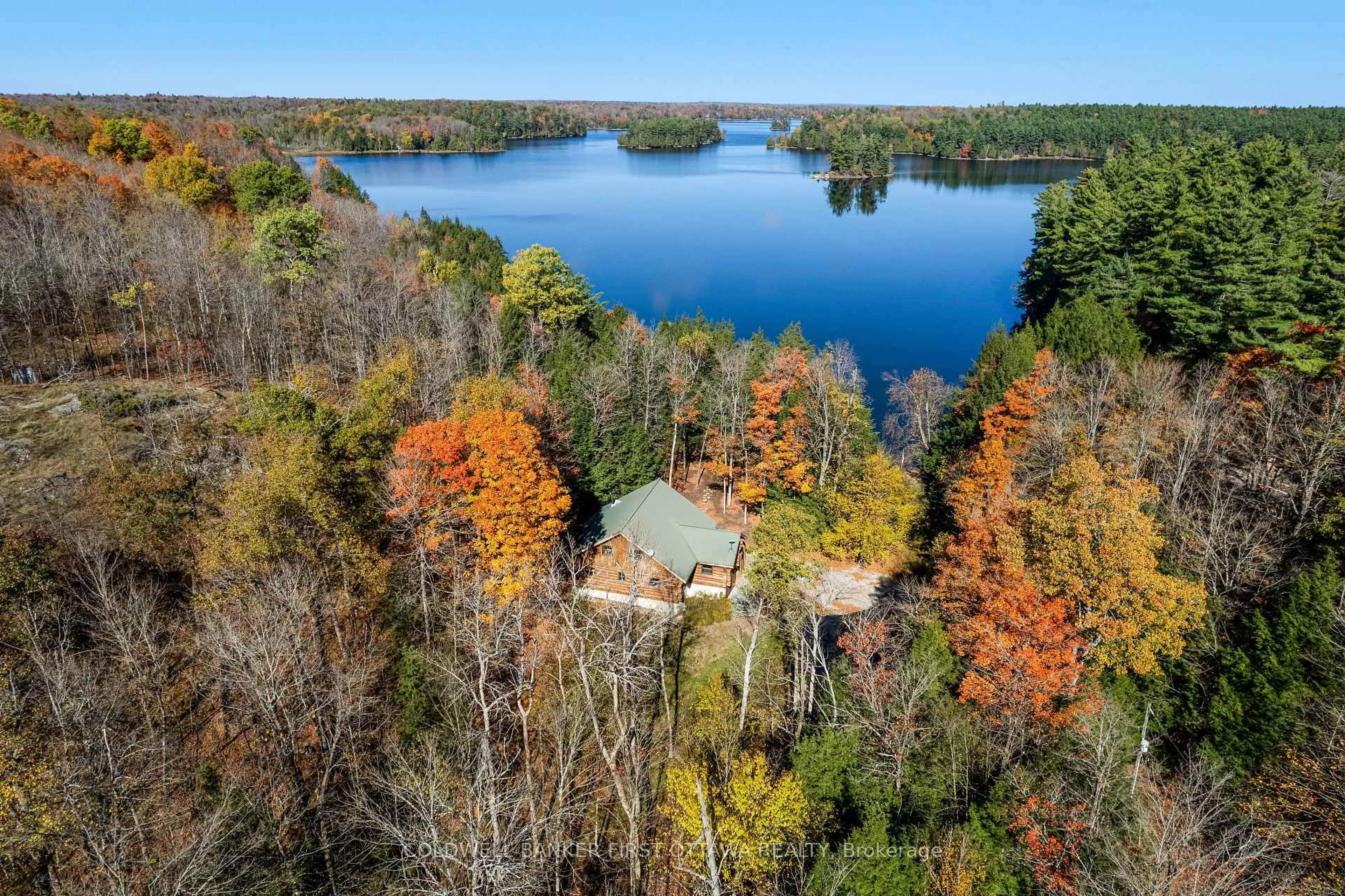 A pic from outside/outdoor area/front of a property/back of a property/a pic from drone, water/lake/river/ocean view for 308 Scott Crt, Maberly Ontario K0H 2B0