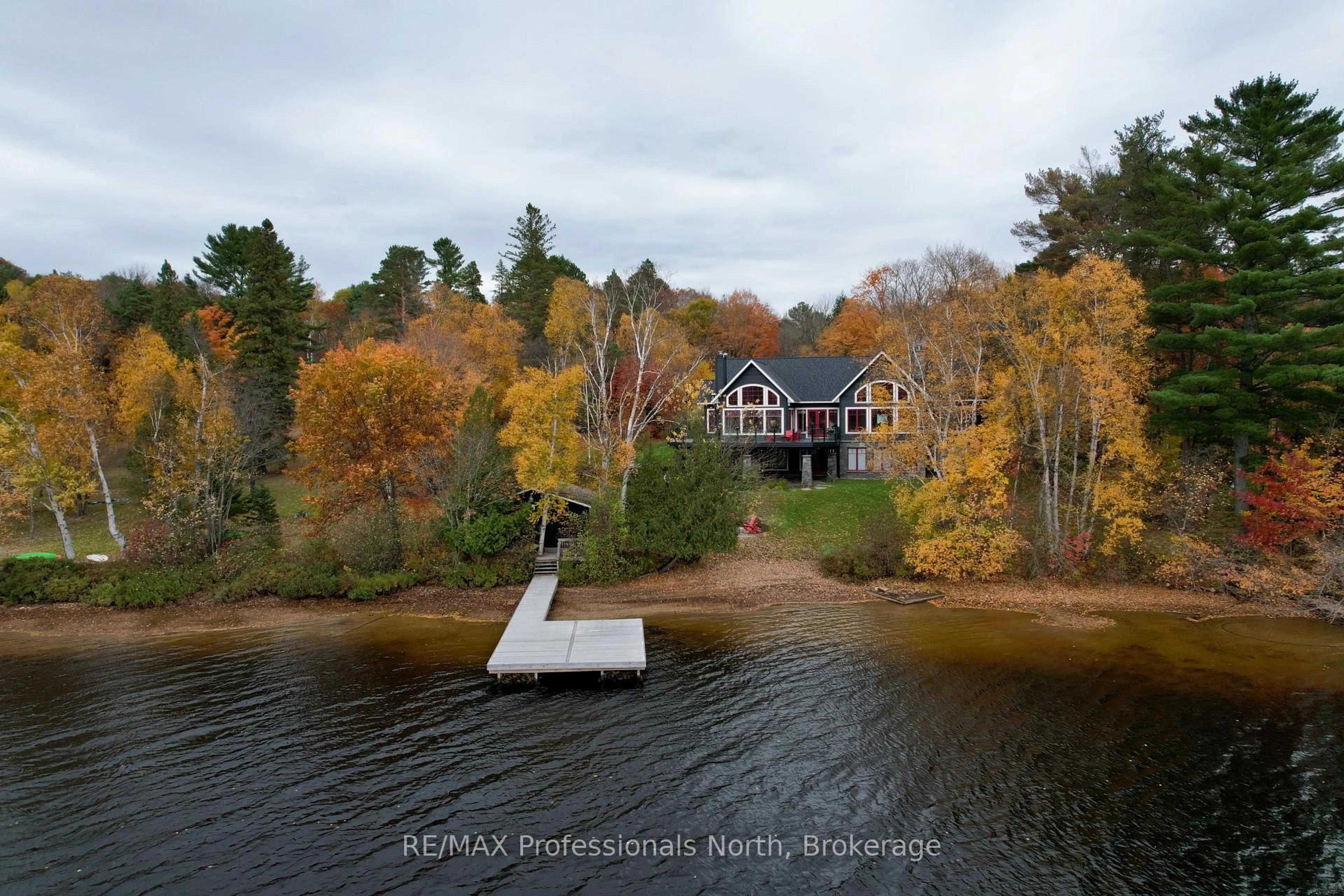A pic from outside/outdoor area/front of a property/back of a property/a pic from drone, water/lake/river/ocean view for 11 Tipper Lane, Huntsville Ontario P1H 2J2