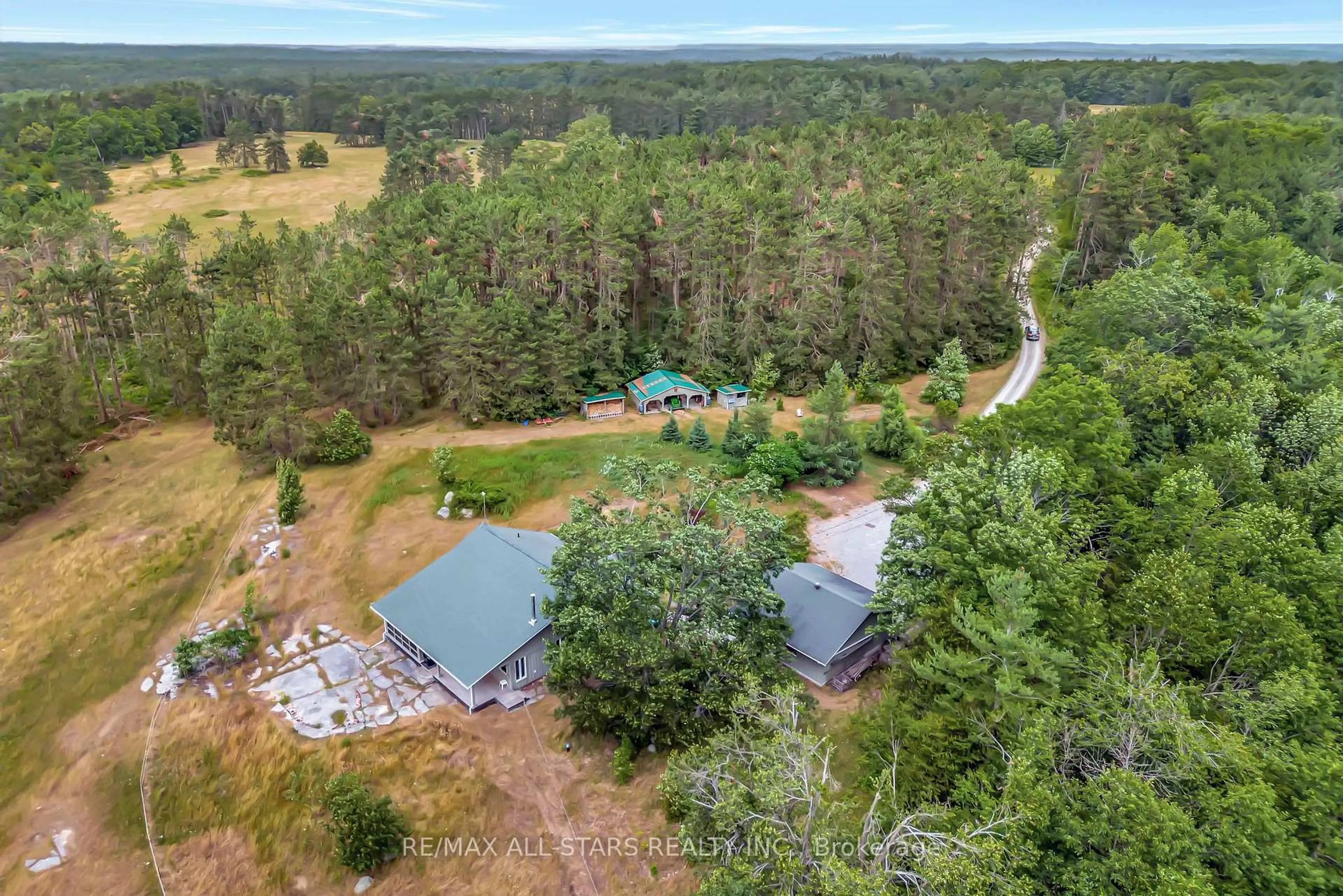 A pic from outside/outdoor area/front of a property/back of a property/a pic from drone, forest/trees view for 485 Burnt River Rd, Kawartha Lakes Ontario K0M 1C0