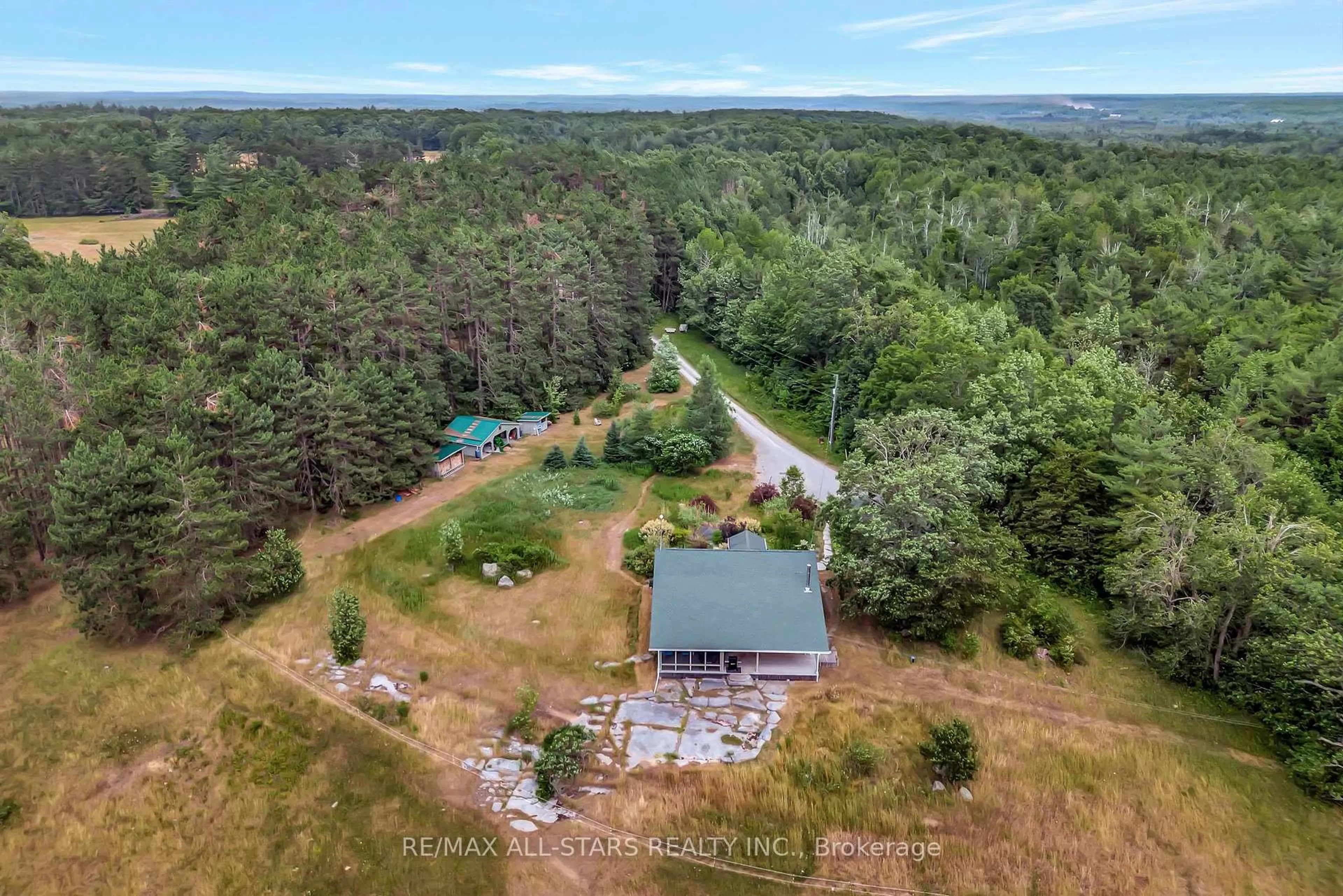 A pic from outside/outdoor area/front of a property/back of a property/a pic from drone, forest/trees view for 485 Burnt River Rd, Kawartha Lakes Ontario K0M 1C0