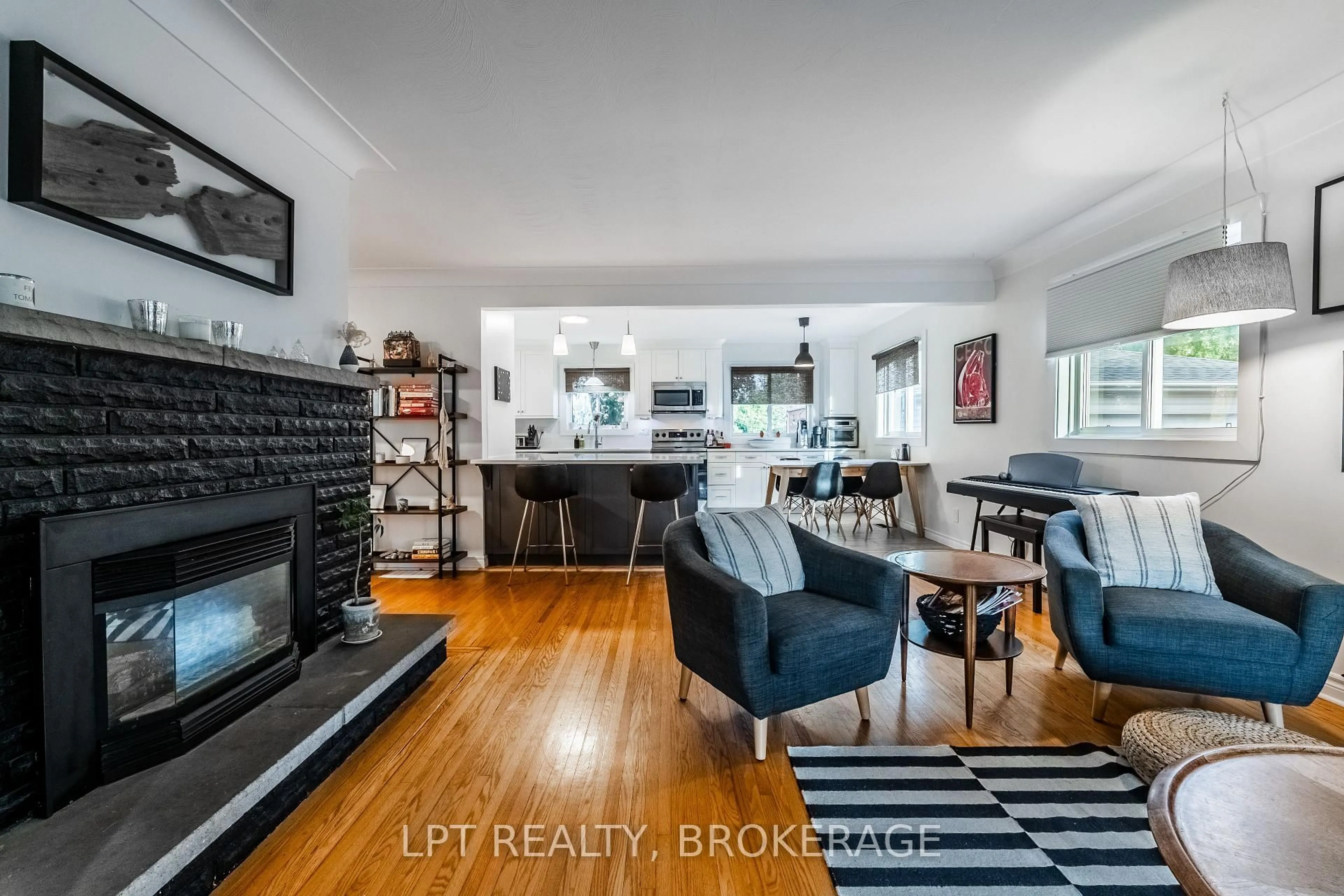 Living room with furniture, wood/laminate floor for 315 Norman Rogers Dr, Kingston Ontario K7M 2R7