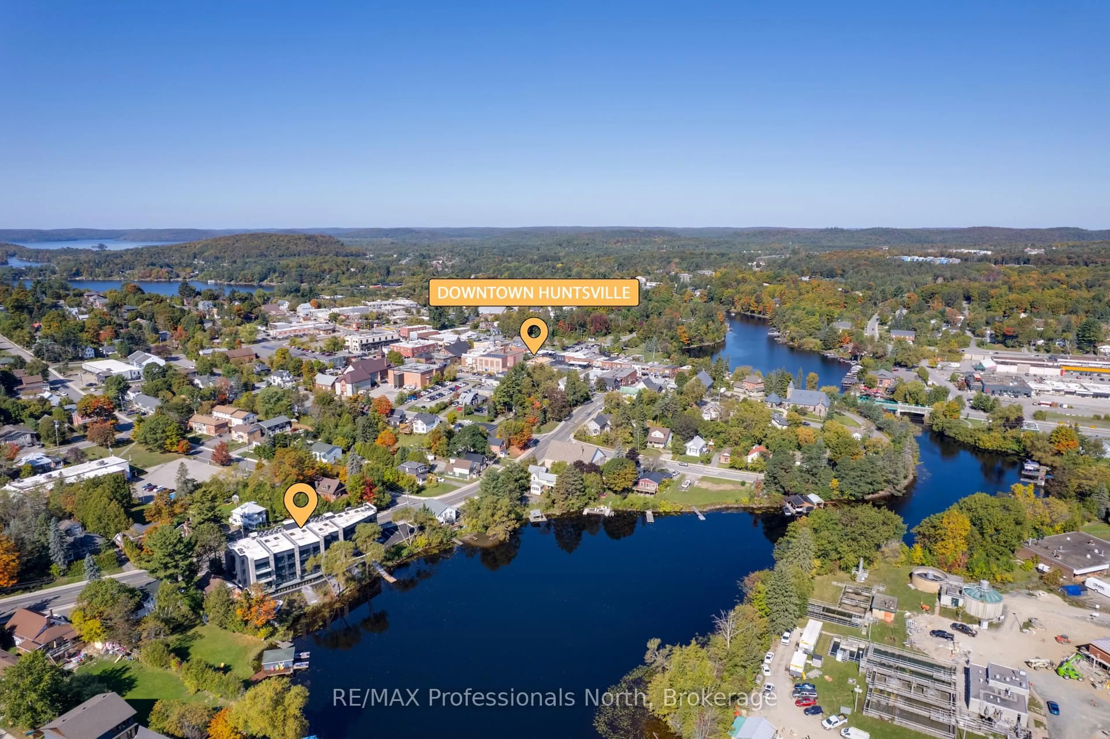 A pic from outside/outdoor area/front of a property/back of a property/a pic from drone, water/lake/river/ocean view for 32 Brunel Rd #102, Huntsville Ontario P1H 1P5