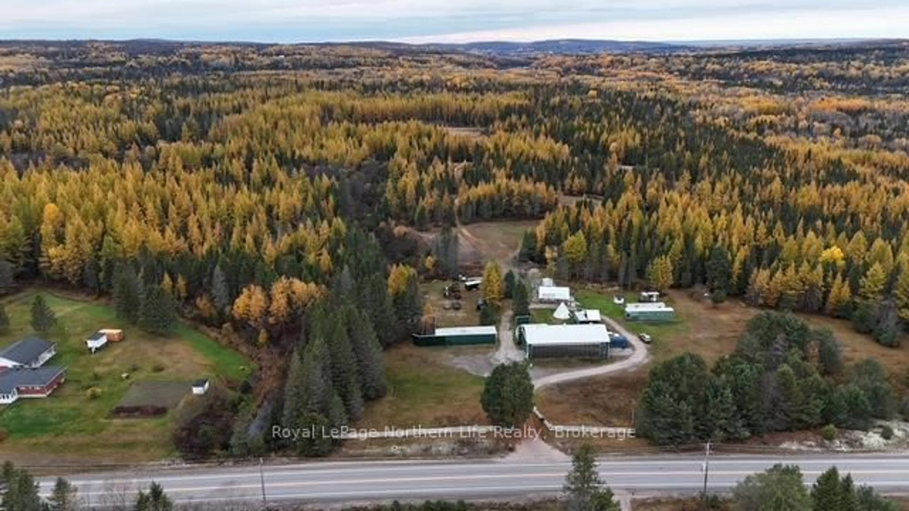 A pic from outside/outdoor area/front of a property/back of a property/a pic from drone, forest/trees view for 970 Highway 522, Powassan Ontario P0H 2L0