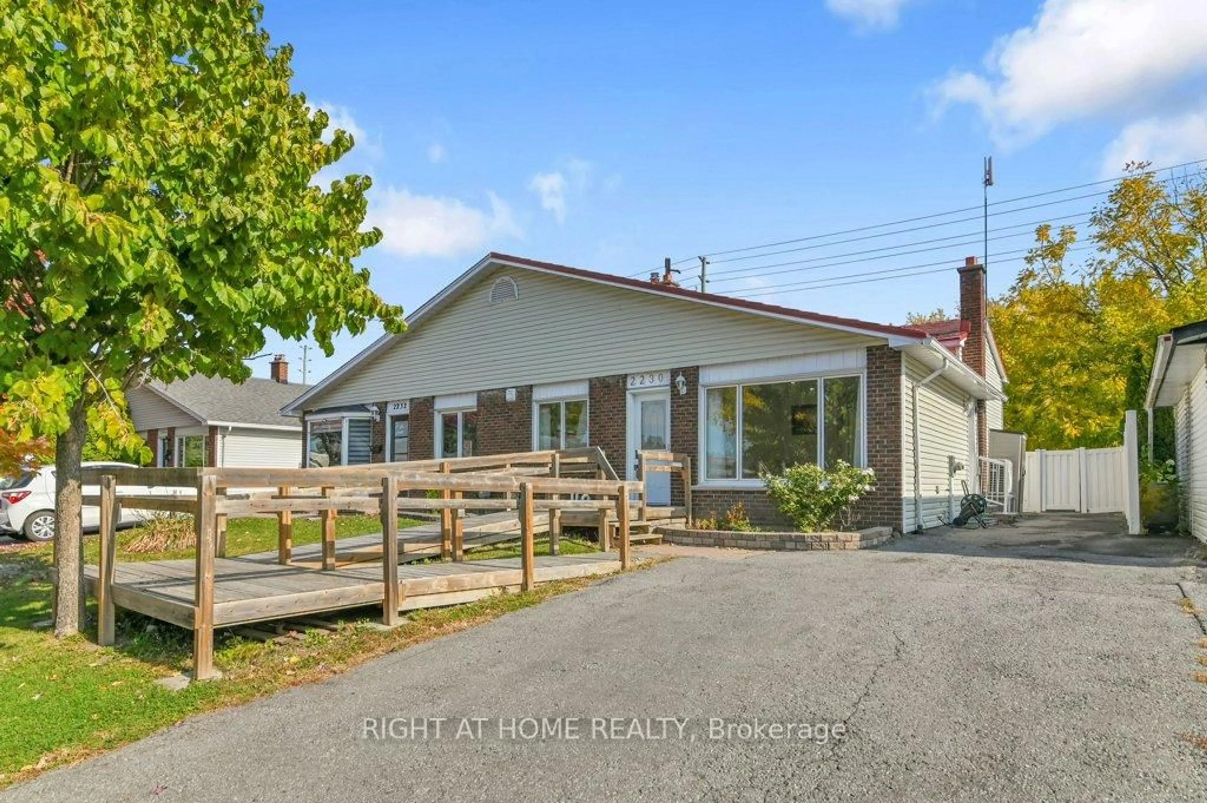A pic from outside/outdoor area/front of a property/back of a property/a pic from drone, street for 2230 Bickerton Ave, Ottawa Ontario K1J 6Y3