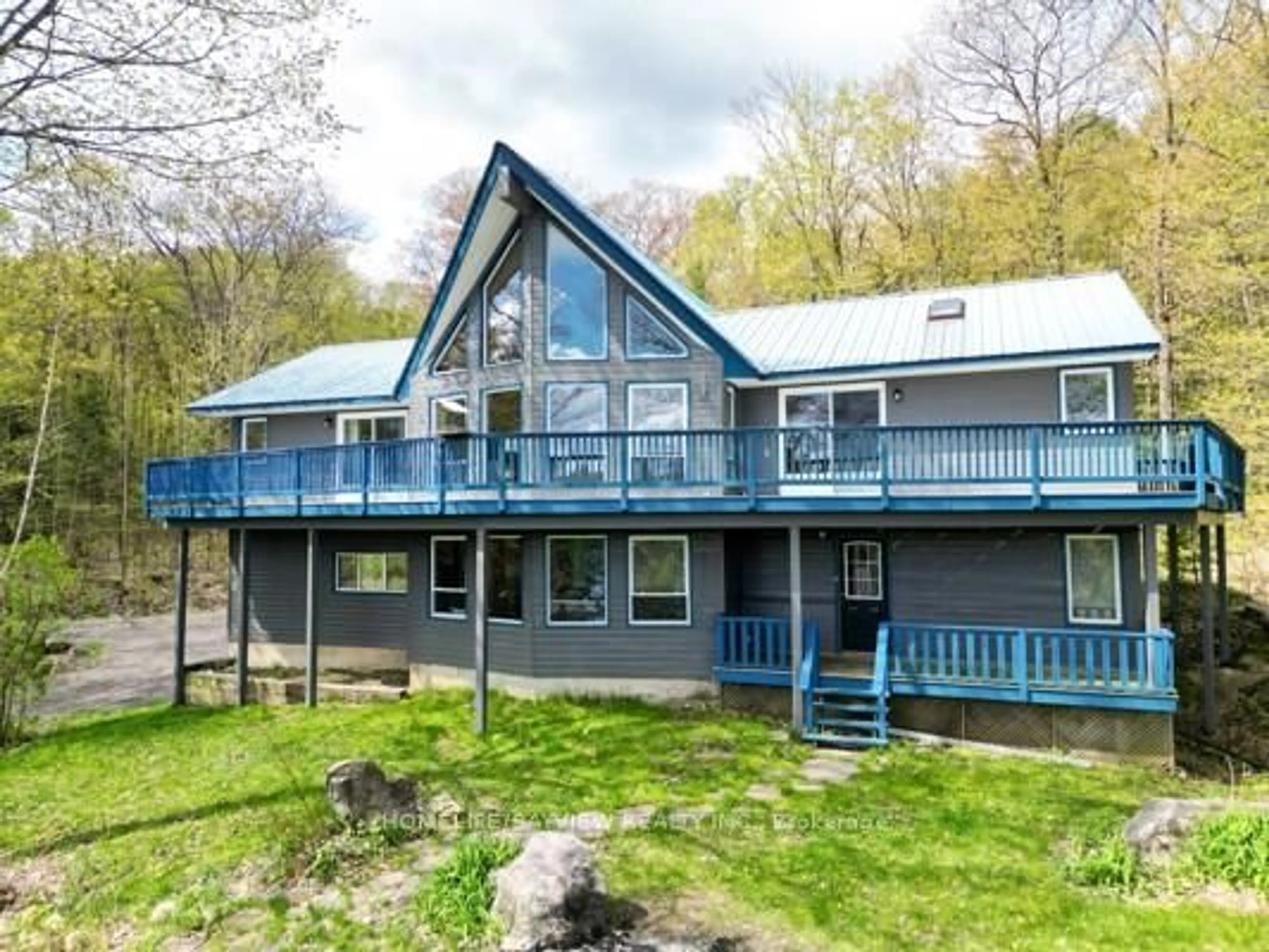 A pic from outside/outdoor area/front of a property/back of a property/a pic from drone, water/lake/river/ocean view for 19243 Hwy 35 Highway, Algonquin Highlands Ontario K0M 1J2