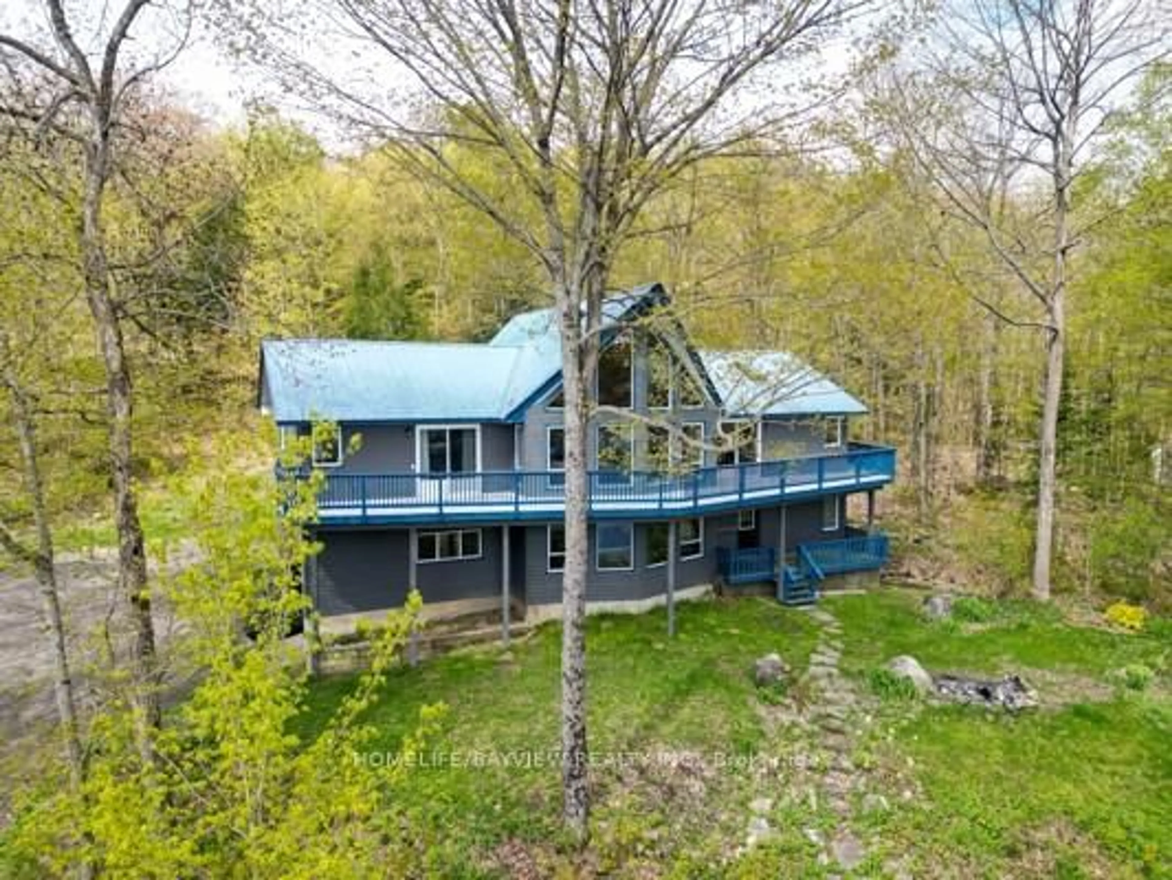 A pic from outside/outdoor area/front of a property/back of a property/a pic from drone, water/lake/river/ocean view for 19243 Hwy 35 Highway, Algonquin Highlands Ontario K0M 1J2