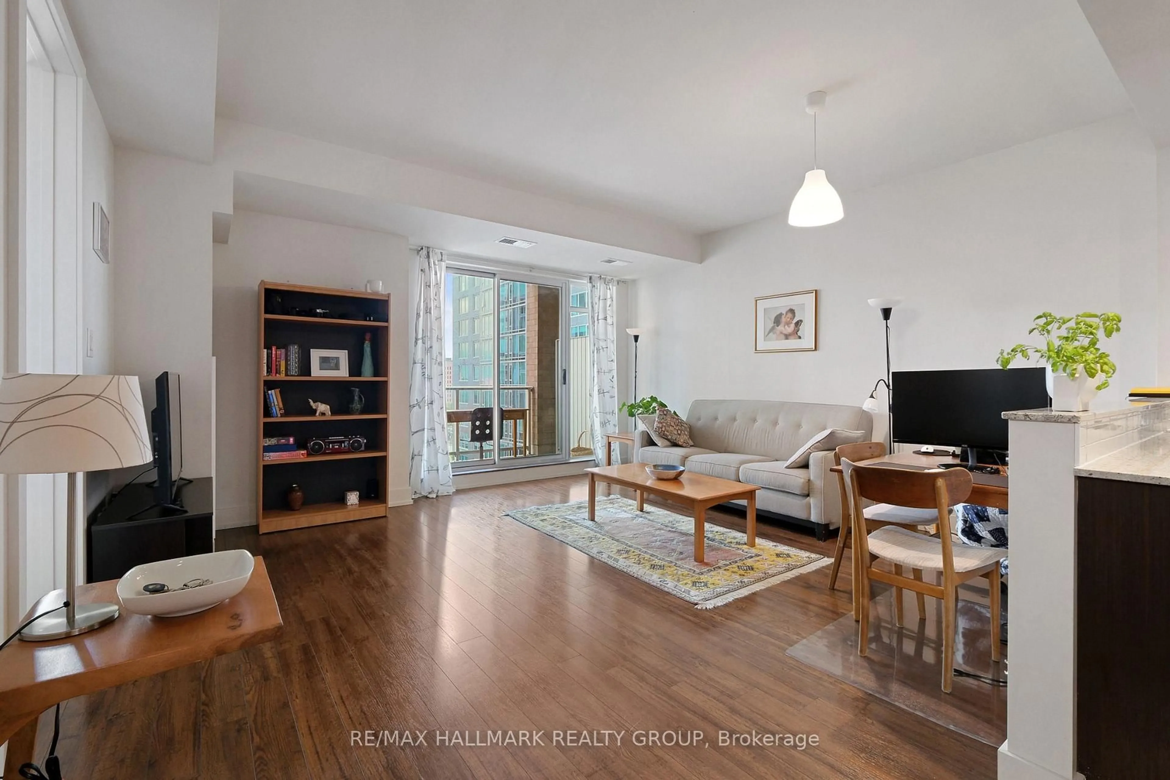 Living room with furniture, wood/laminate floor for 100 Champagne Ave #706, Ottawa Ontario K1S 4P4