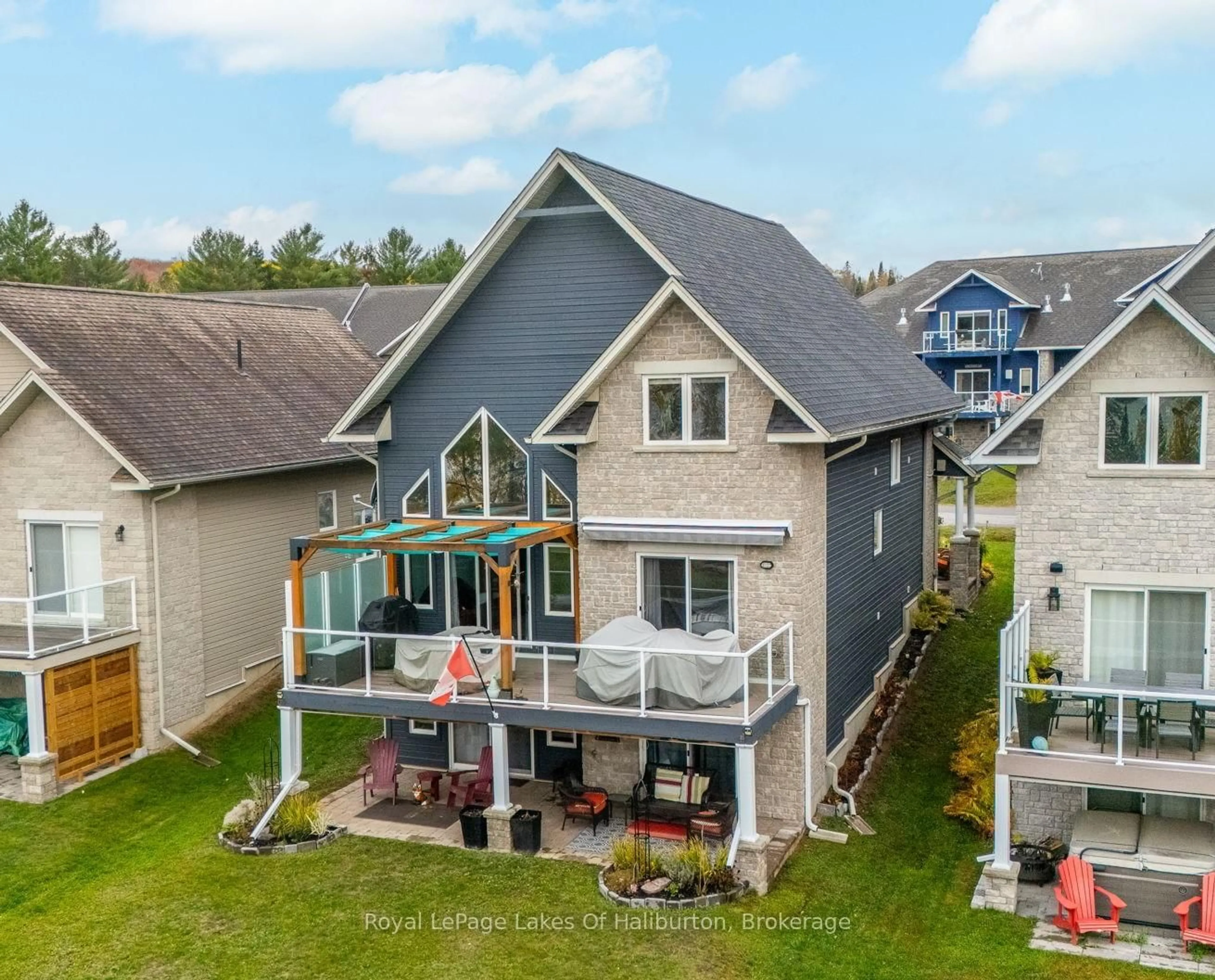 A pic from outside/outdoor area/front of a property/back of a property/a pic from drone, water/lake/river/ocean view for 9 Webb Circ, Dysart et al Ontario K0M 1S0