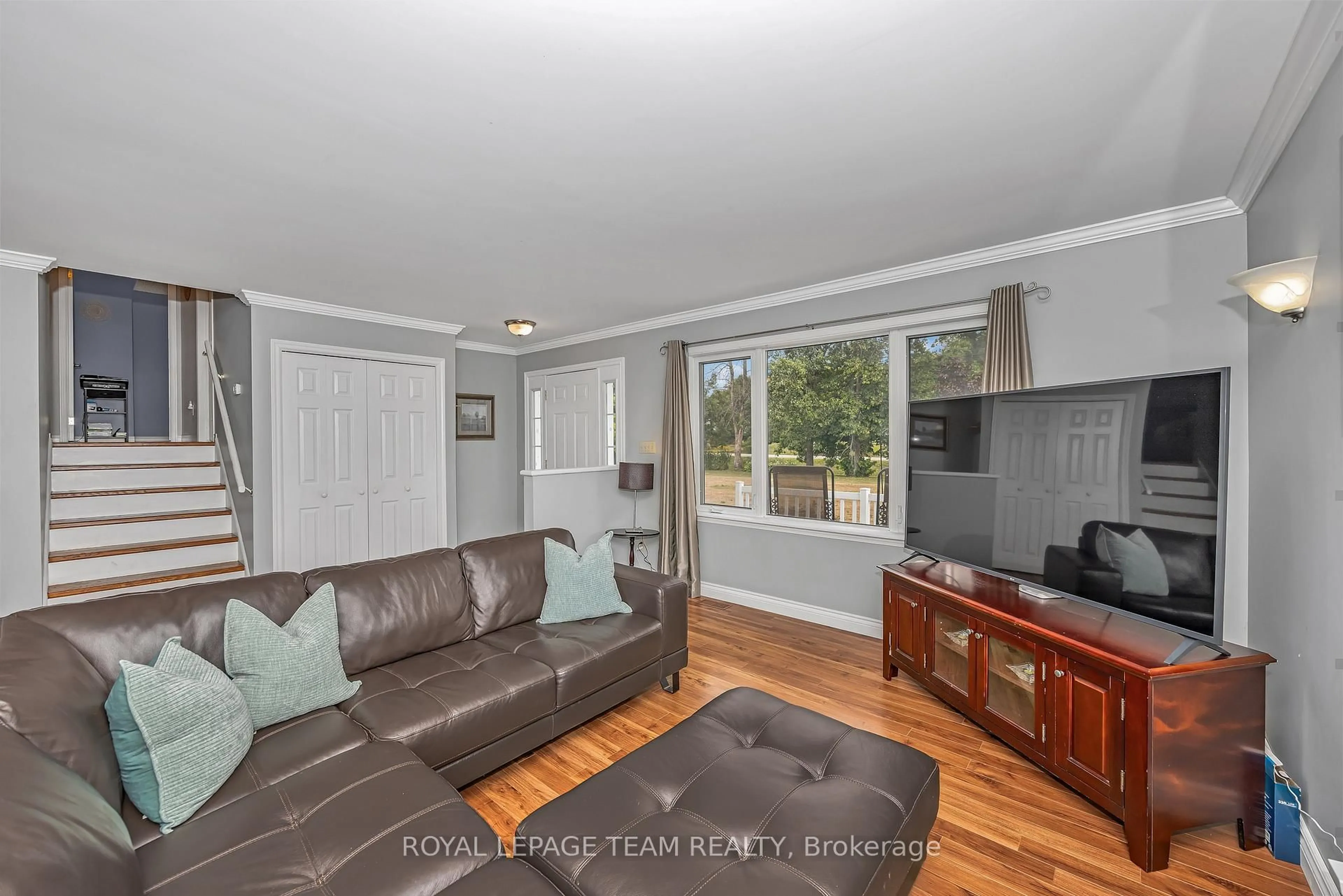 Living room with furniture, wood/laminate floor for 772 Kitley Line 3 Rd, Elizabethtown-Kitley Ontario K0G 1G0