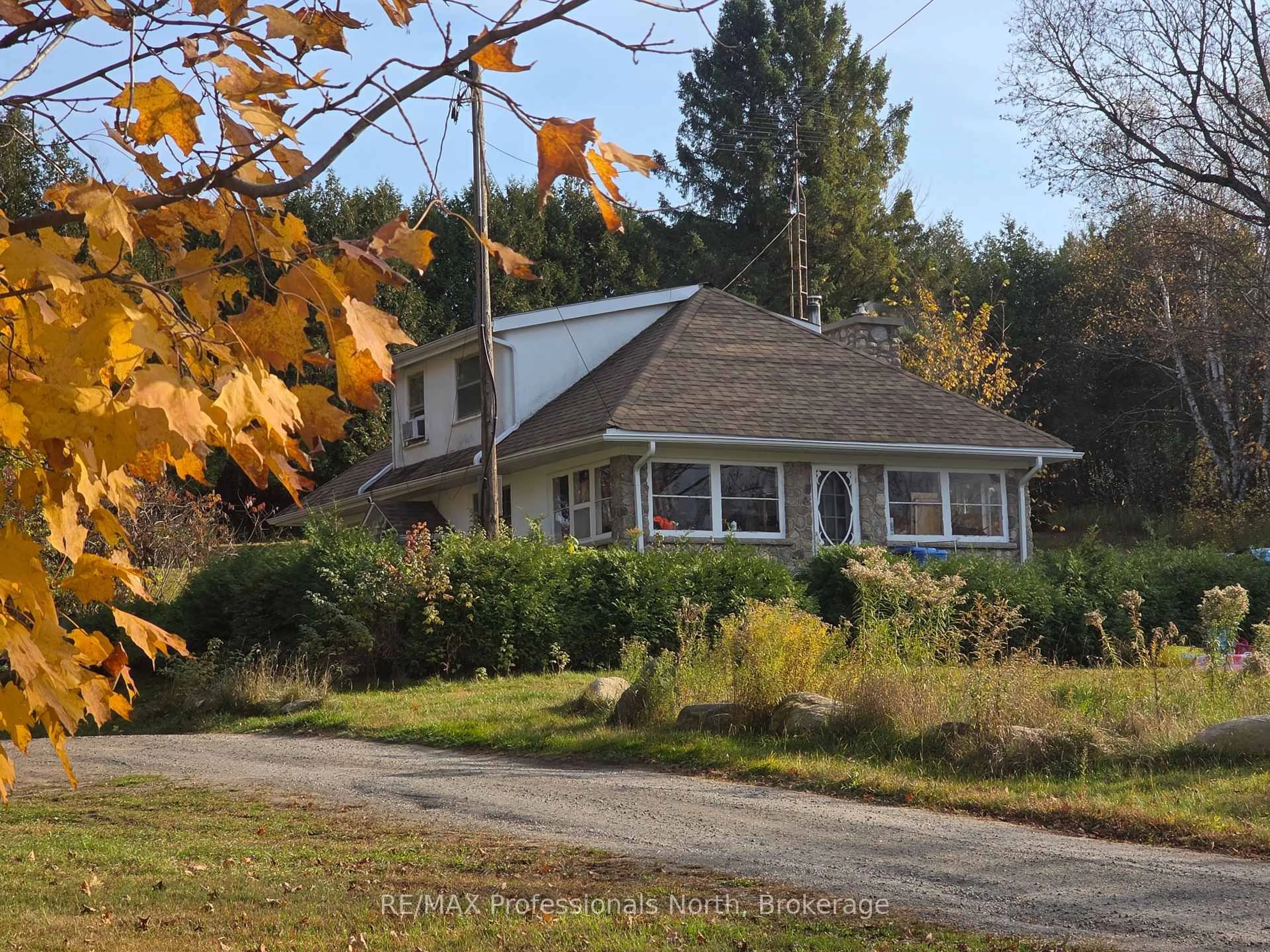 A pic from outside/outdoor area/front of a property/back of a property/a pic from drone, street for 10416 Highway 118, Algonquin Highlands Ontario K0M 1S0