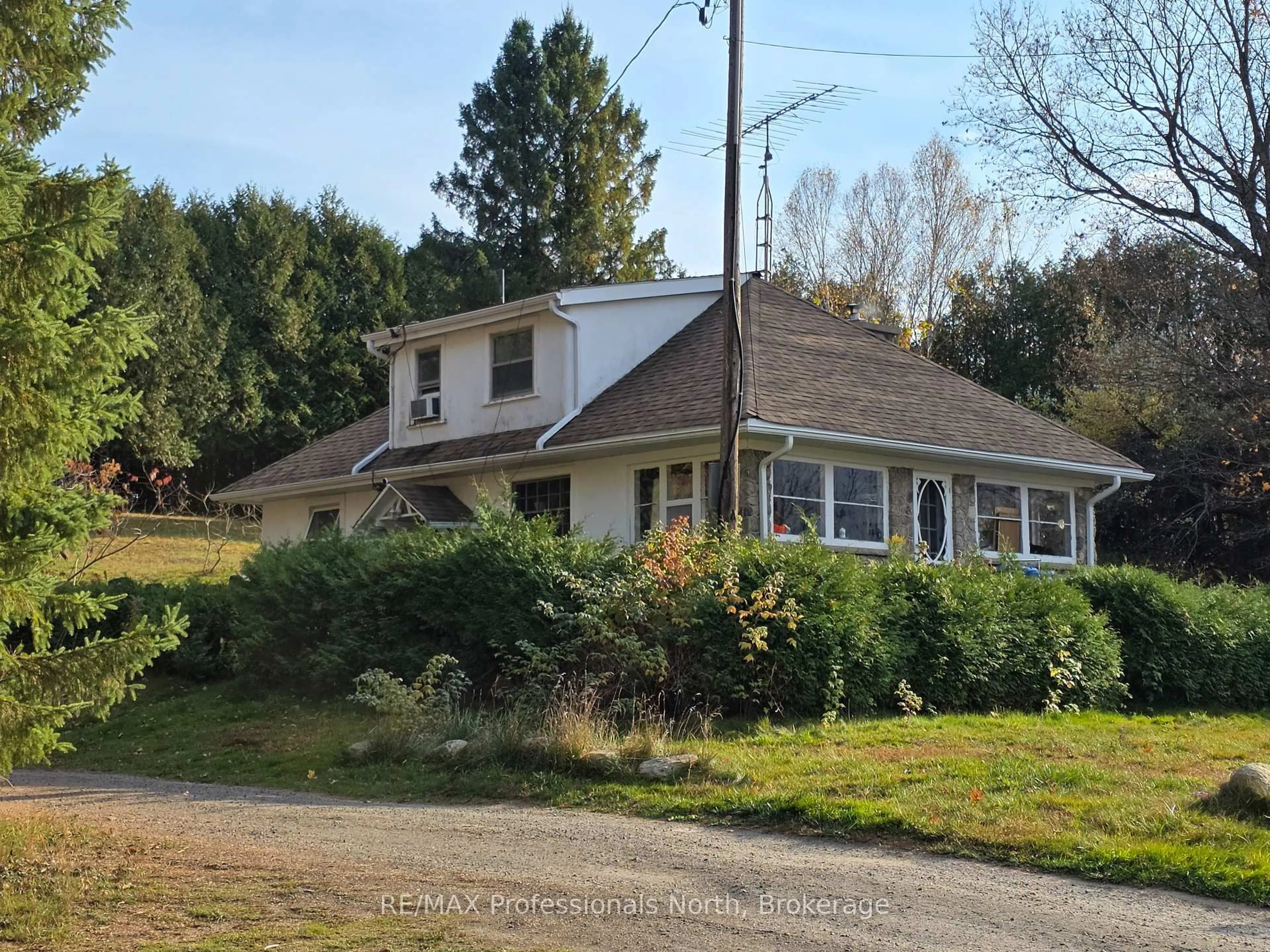 A pic from outside/outdoor area/front of a property/back of a property/a pic from drone, unknown for 10416 Highway 118, Algonquin Highlands Ontario K0M 1S0