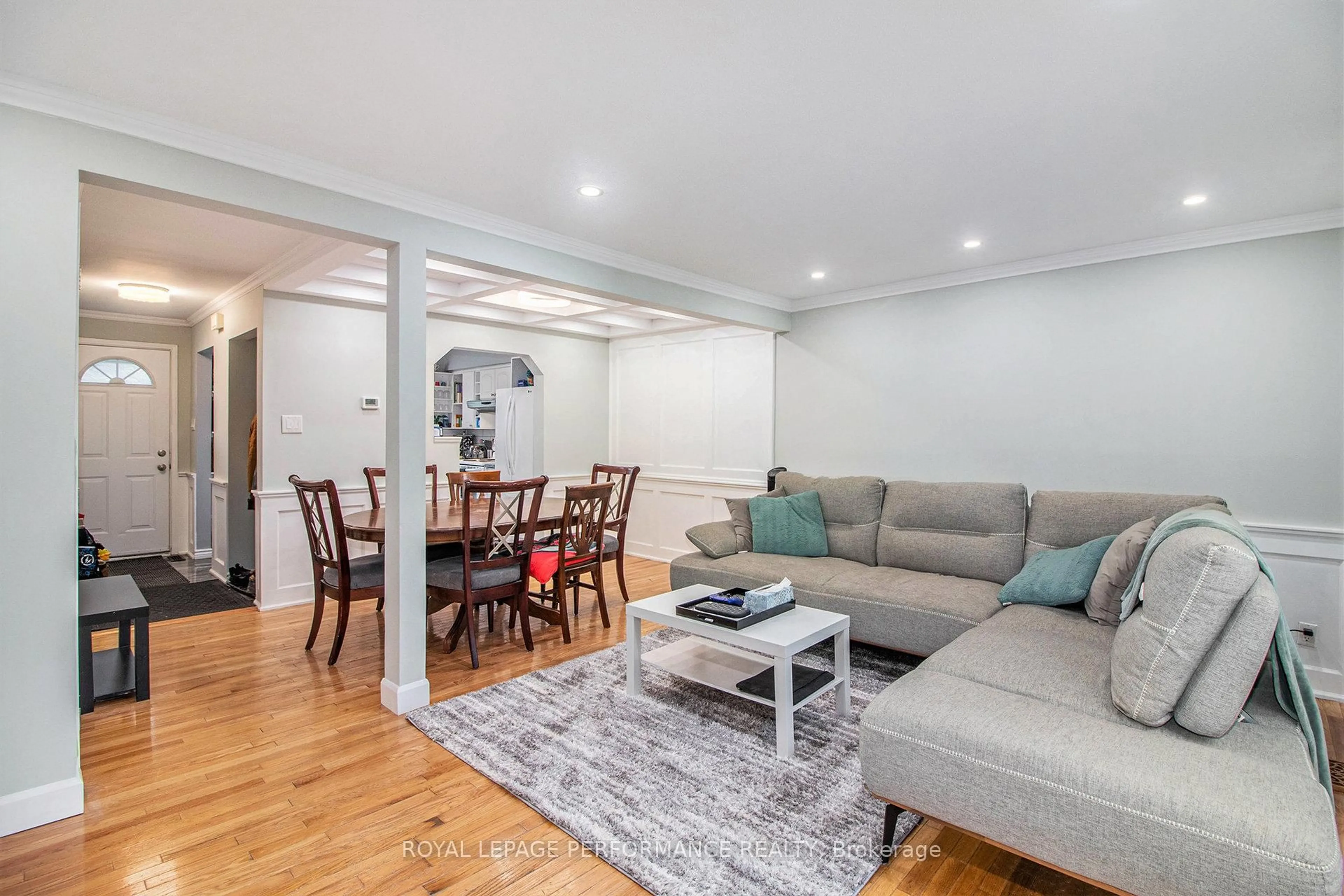 Living room with furniture, wood/laminate floor for 6181 Brookside Lane #43, Ottawa Ontario K1C 2K6