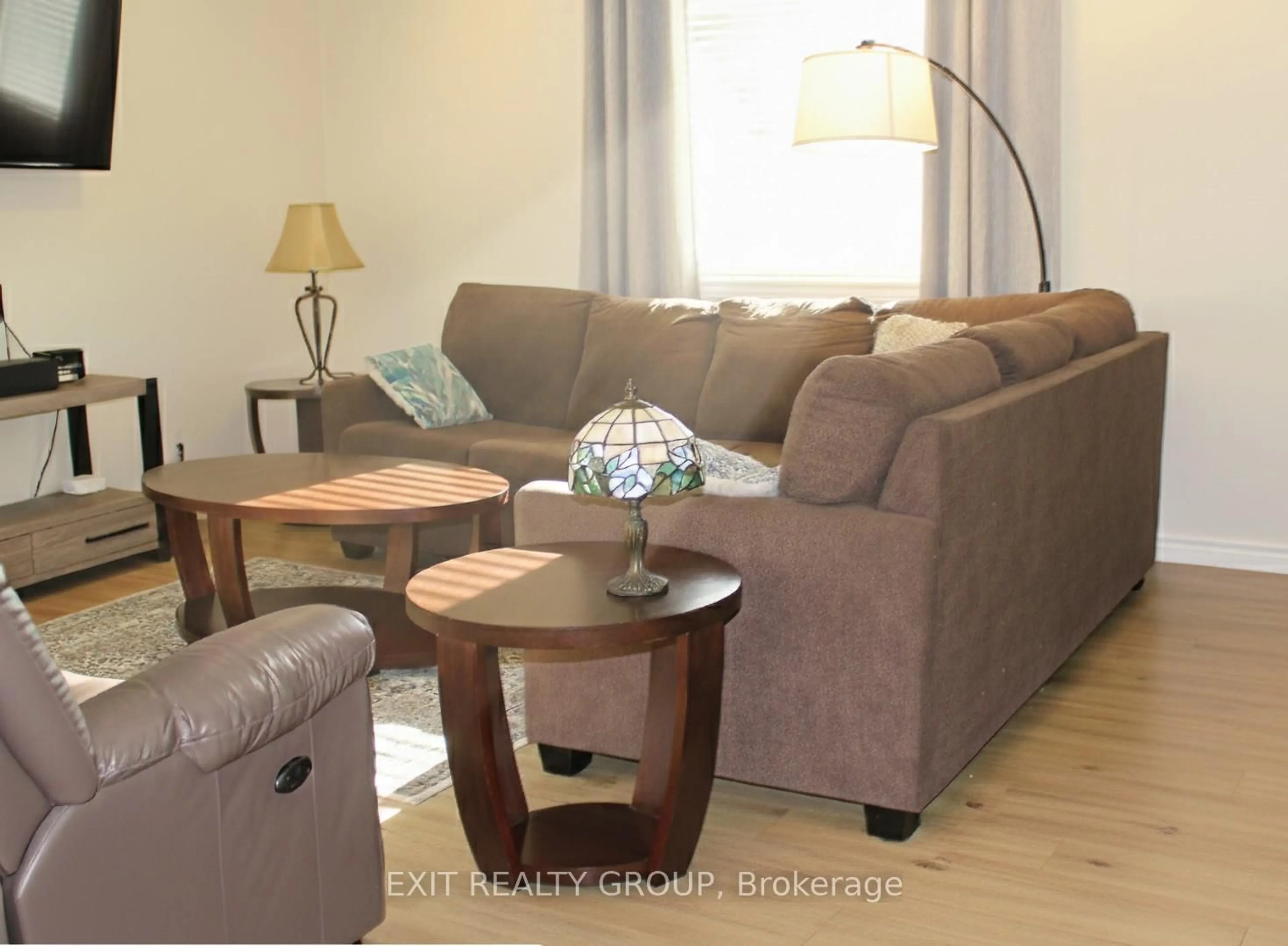 Living room with furniture, wood/laminate floor for 8321 County Road 50, Trent Hills Ontario K0K 2M0