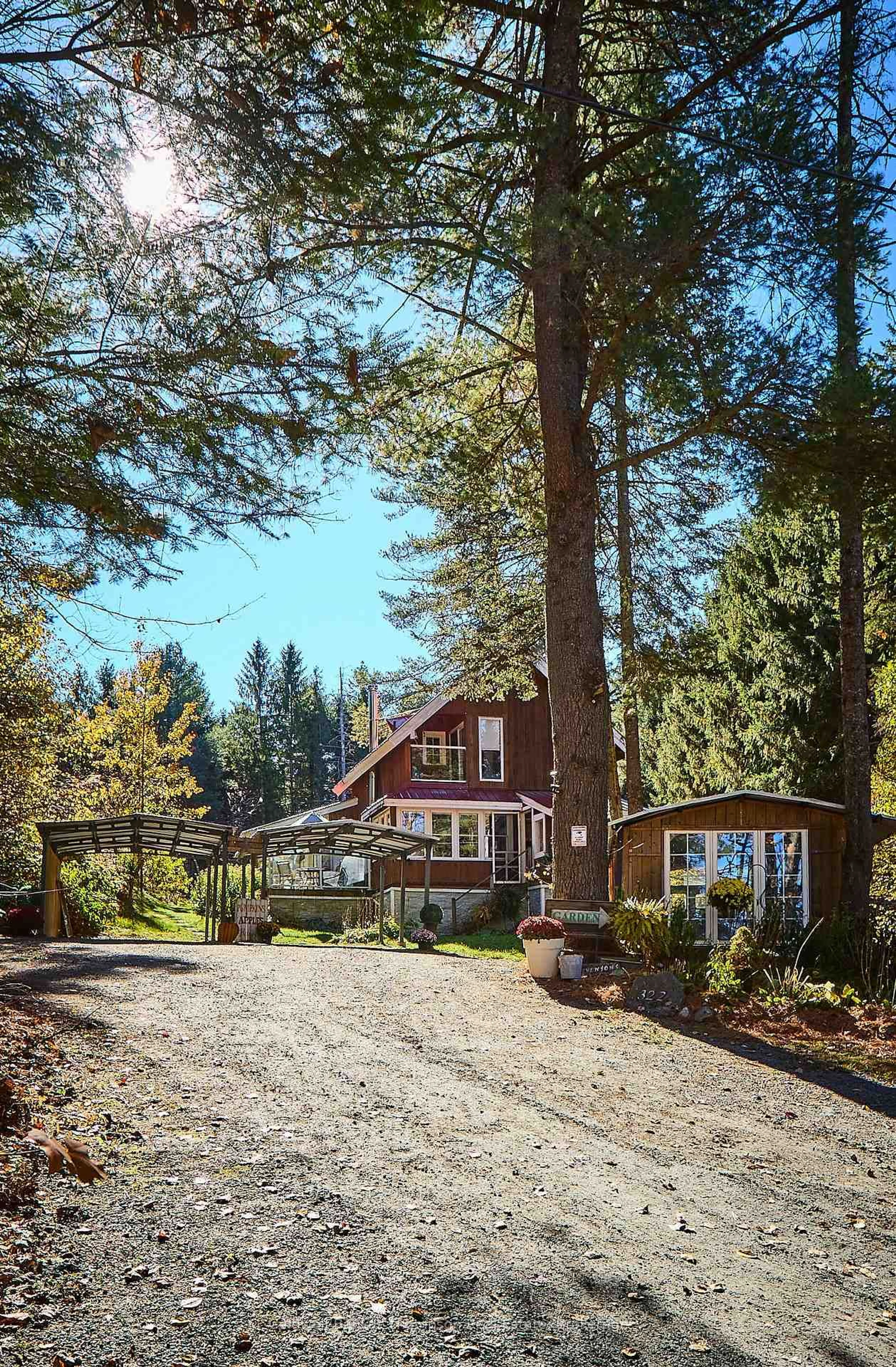 A pic from outside/outdoor area/front of a property/back of a property/a pic from drone, forest/trees view for 322 Balsam Chutes Rd, Huntsville Ontario P0B 1L0