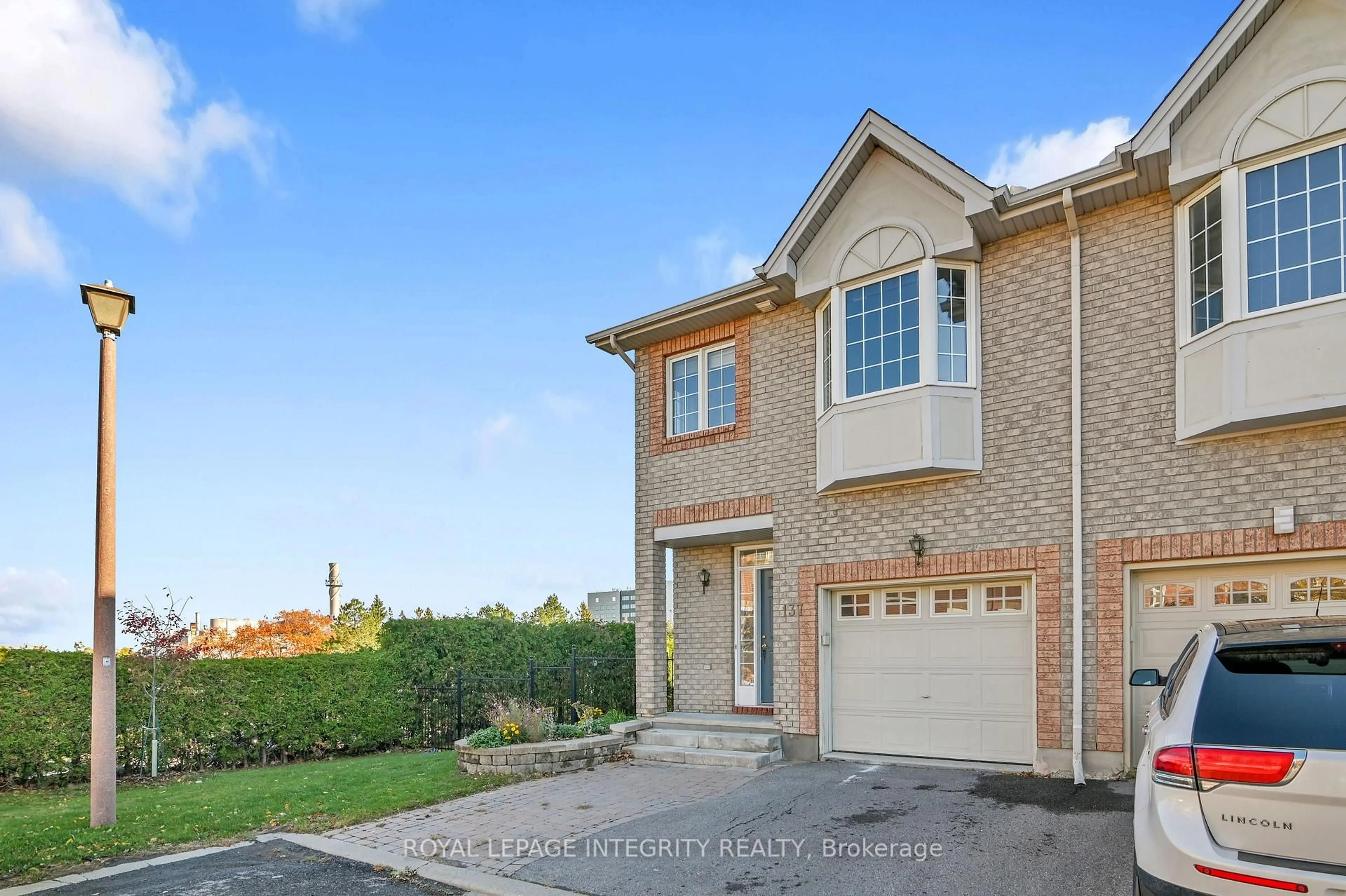 Home with brick exterior material, street for 137 Tall Oak Private, Ottawa Ontario K1G 6T3