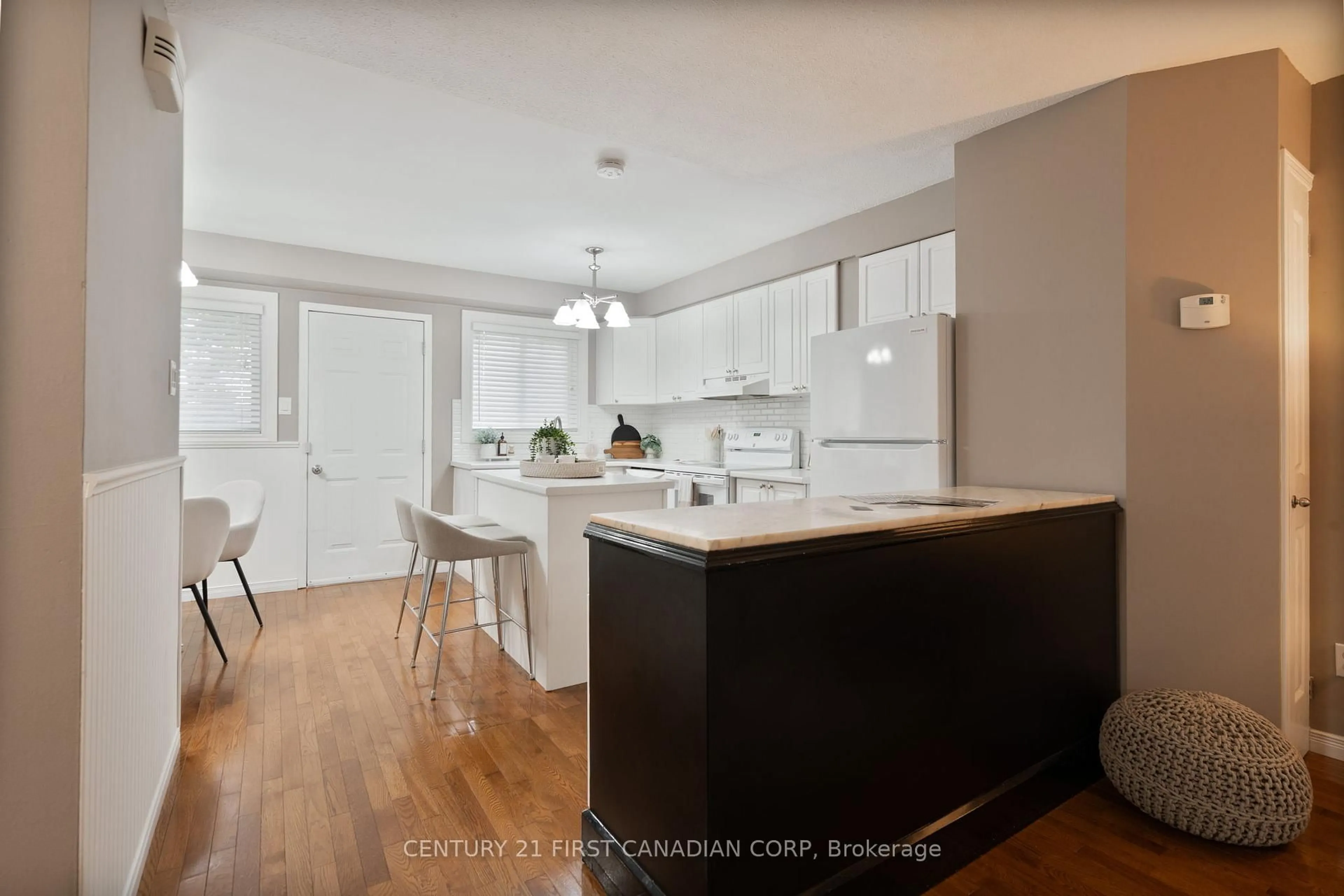 Open concept kitchen, wood/laminate floor for 320 Westminster Ave #21, London South Ontario N6C 5H5