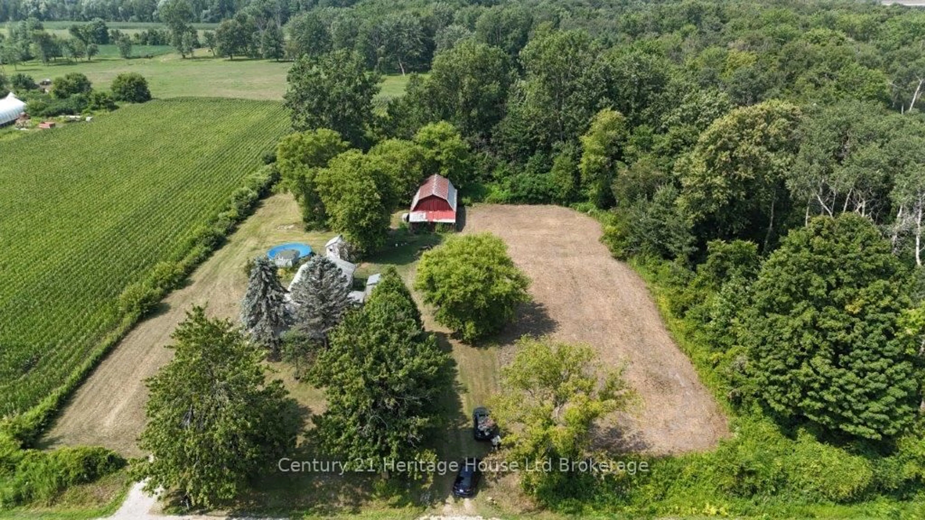 A pic from outside/outdoor area/front of a property/back of a property/a pic from drone, forest/trees view for 712011 Middletown Line, Norwich Ontario N4G 4G7
