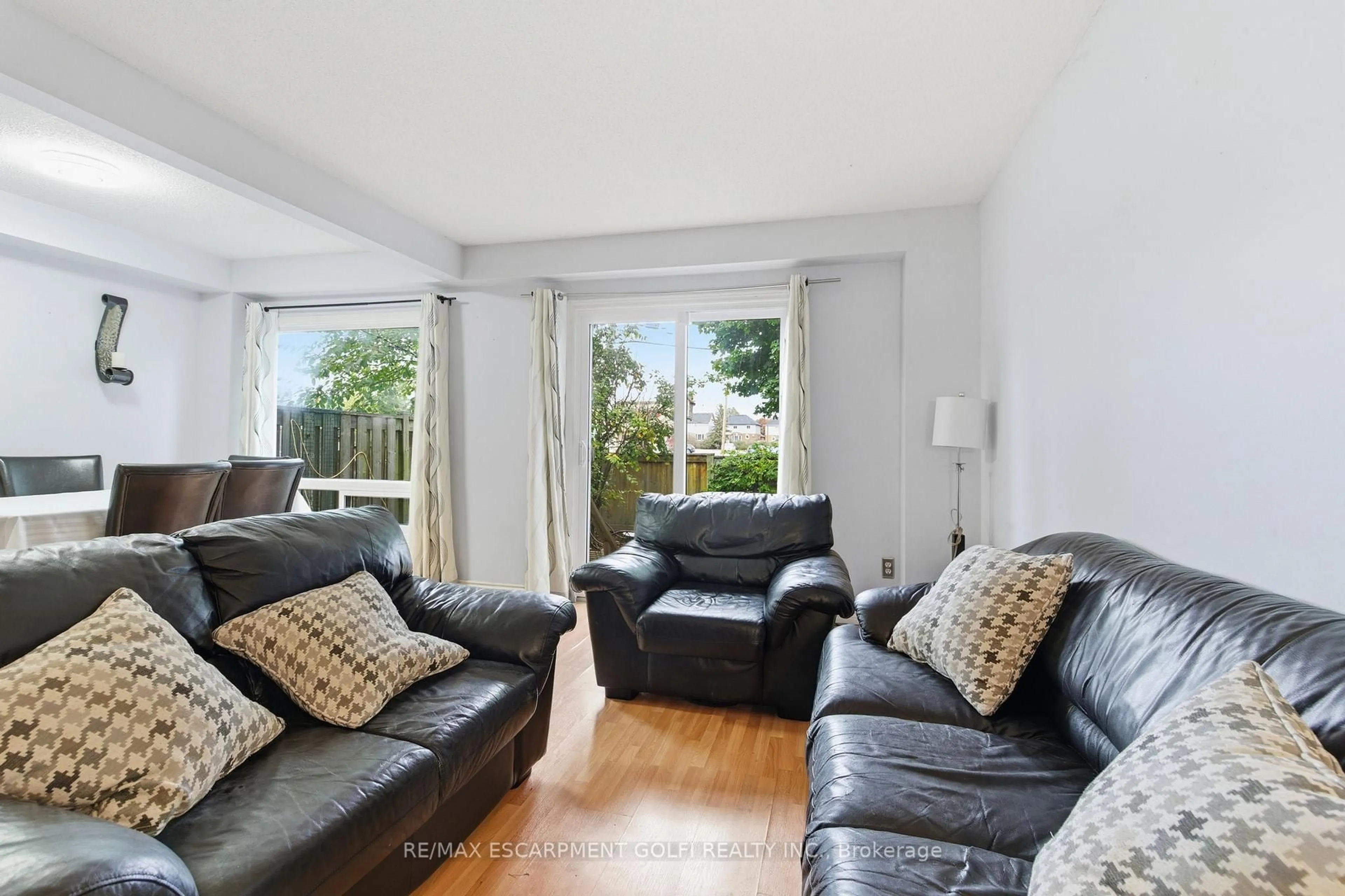 Living room with furniture, unknown for 15 Derby St #12, Hamilton Ontario L8W 3T3