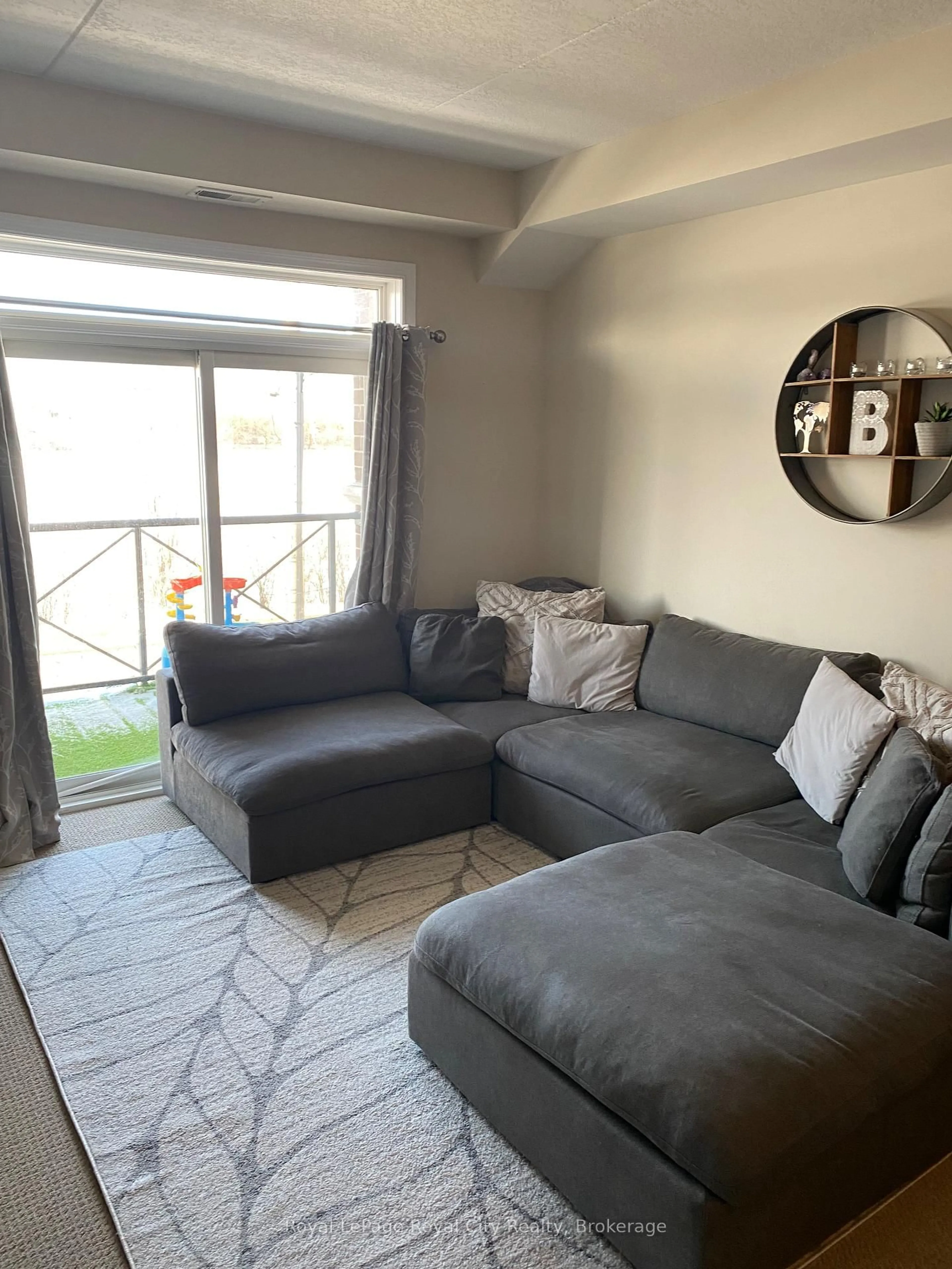 Living room with furniture, unknown for 2 Colonial Dr #207, Guelph Ontario N1L 0K8
