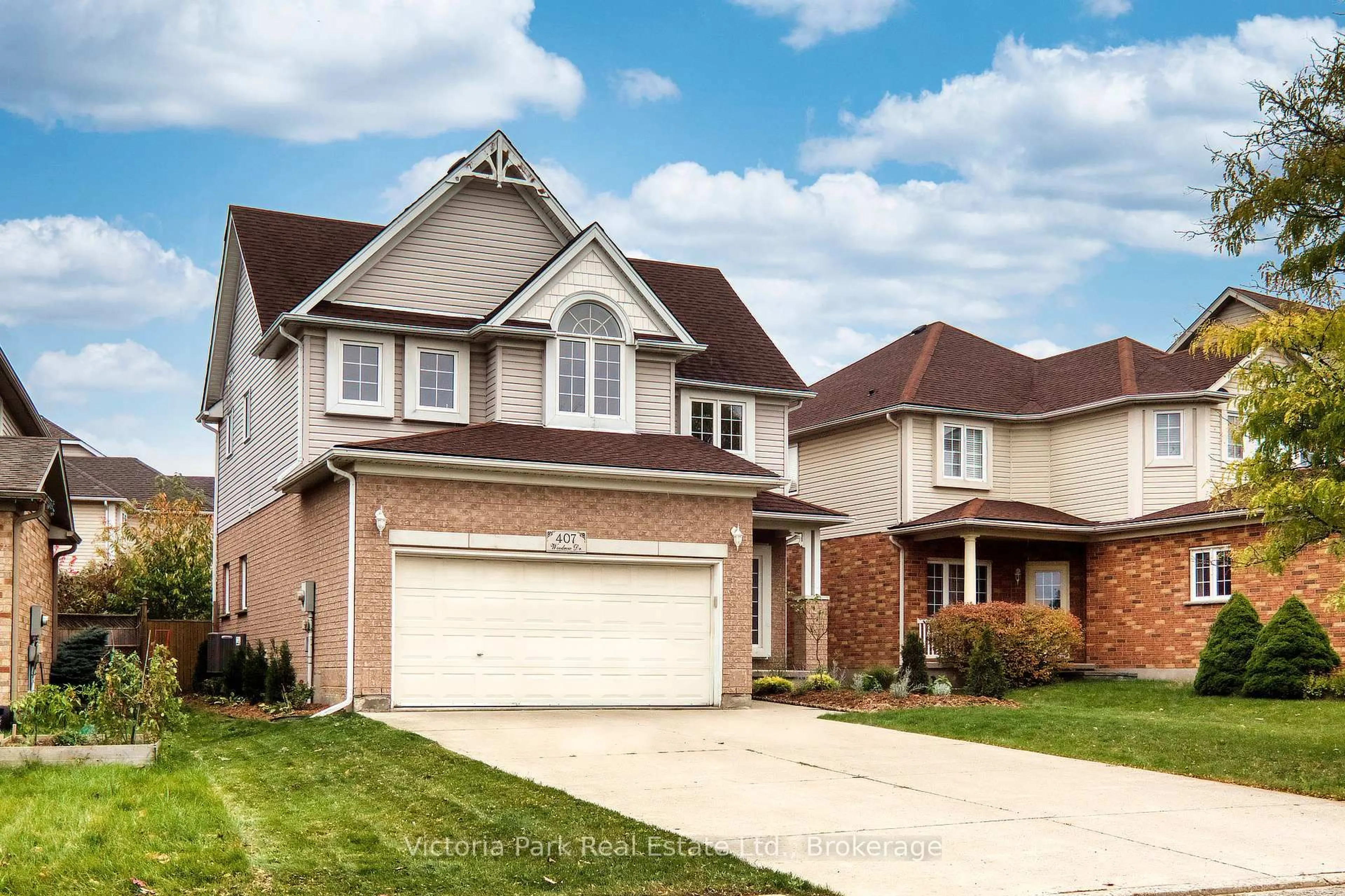 Home with brick exterior material, street for 407 Woodrow Dr, Waterloo Ontario N2T 2V7