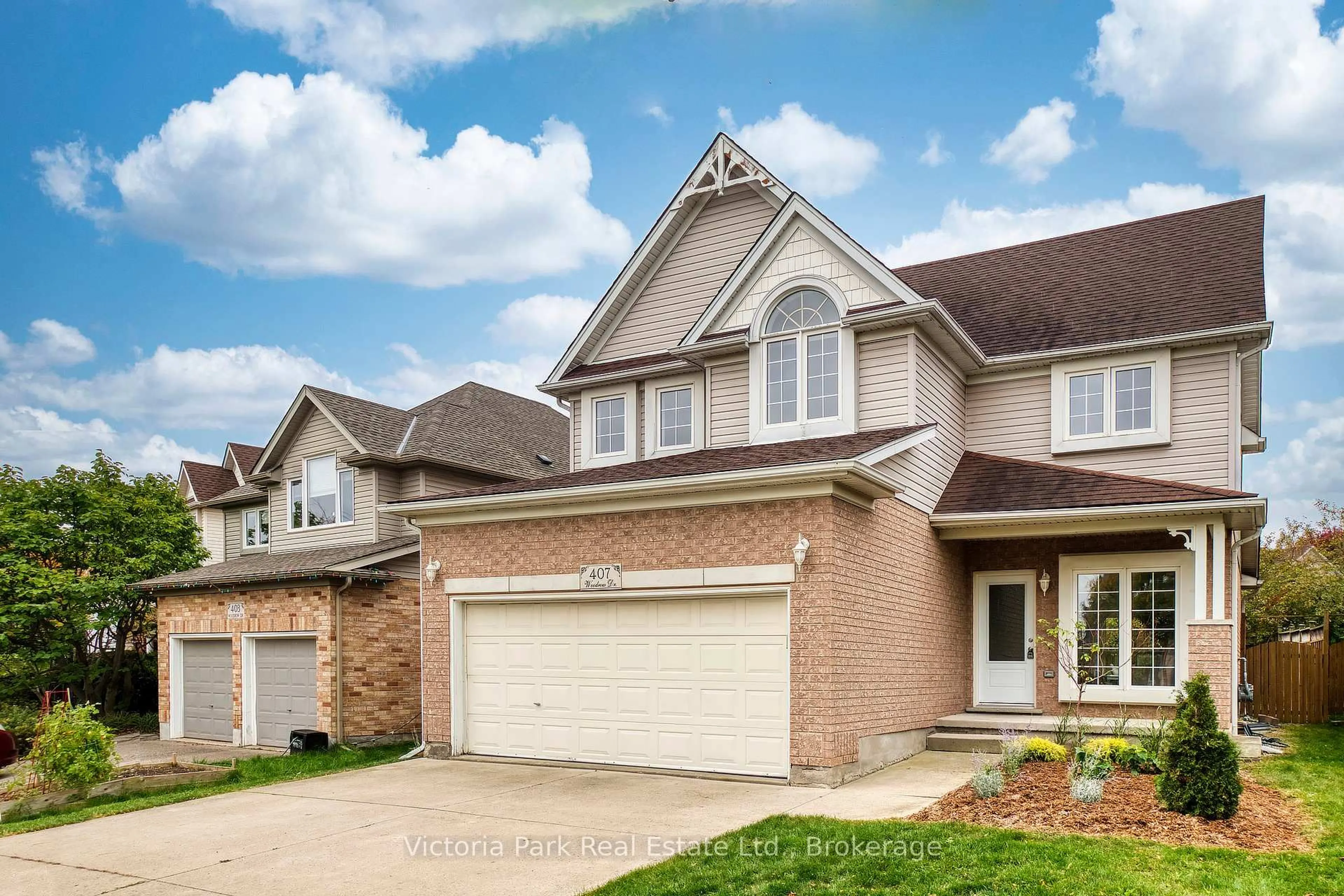 Home with brick exterior material, street for 407 Woodrow Dr, Waterloo Ontario N2T 2V7