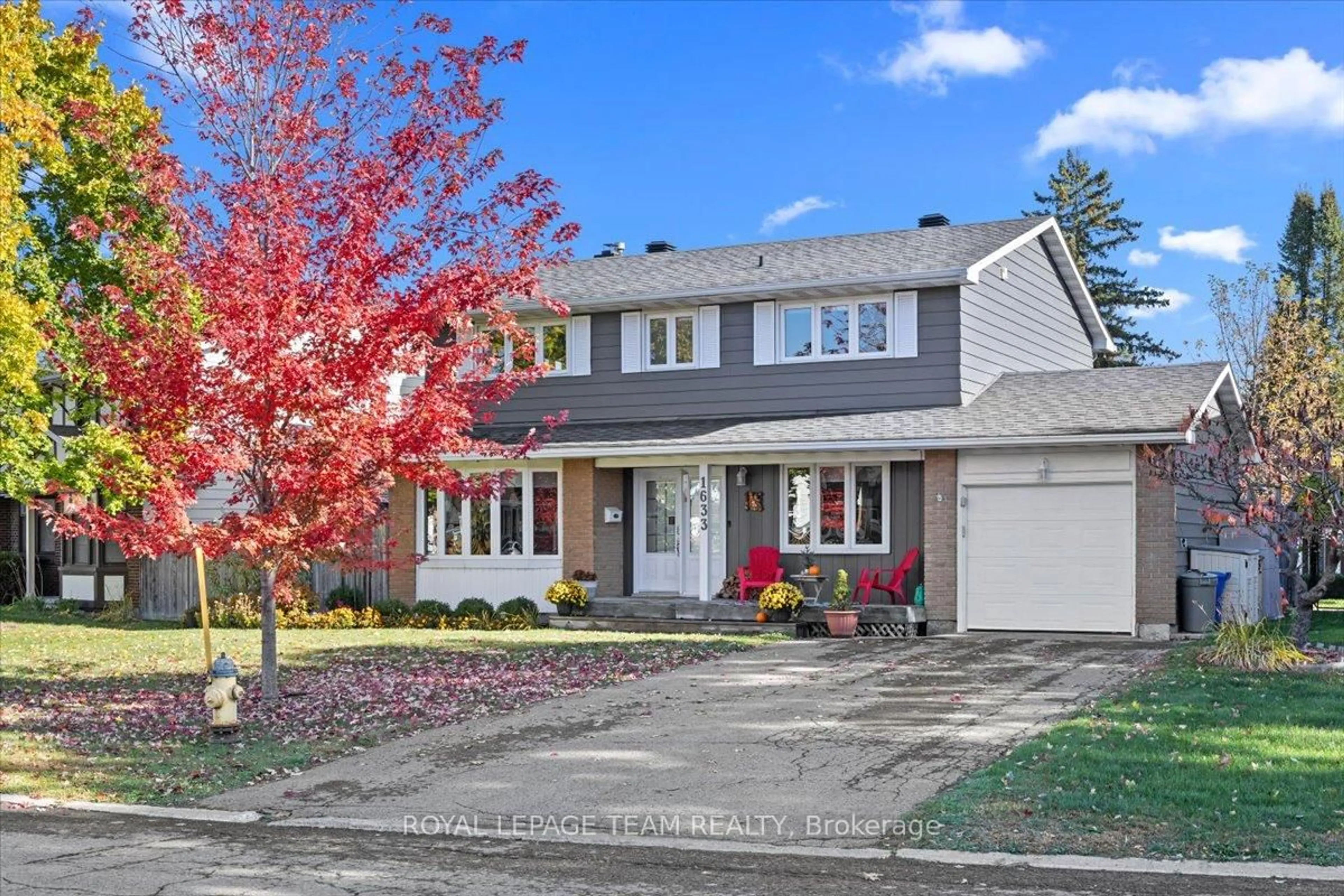 Home with vinyl exterior material, street for 1633 Grey Nuns Dr, Orleans Ontario K1C 1T8