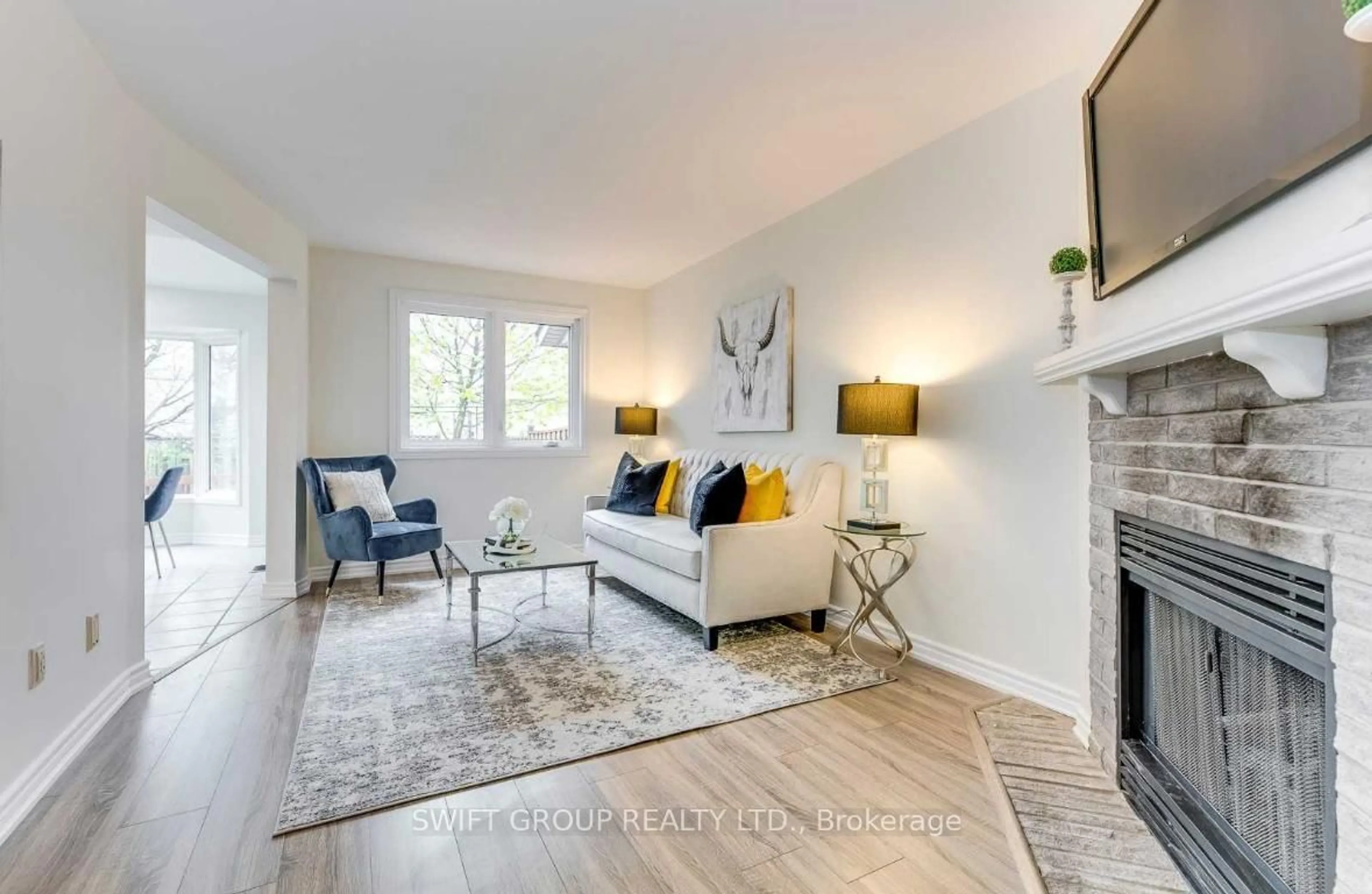Living room with furniture, wood/laminate floor for 3 Perthshire Crt, Hamilton Ontario L9K 1R6