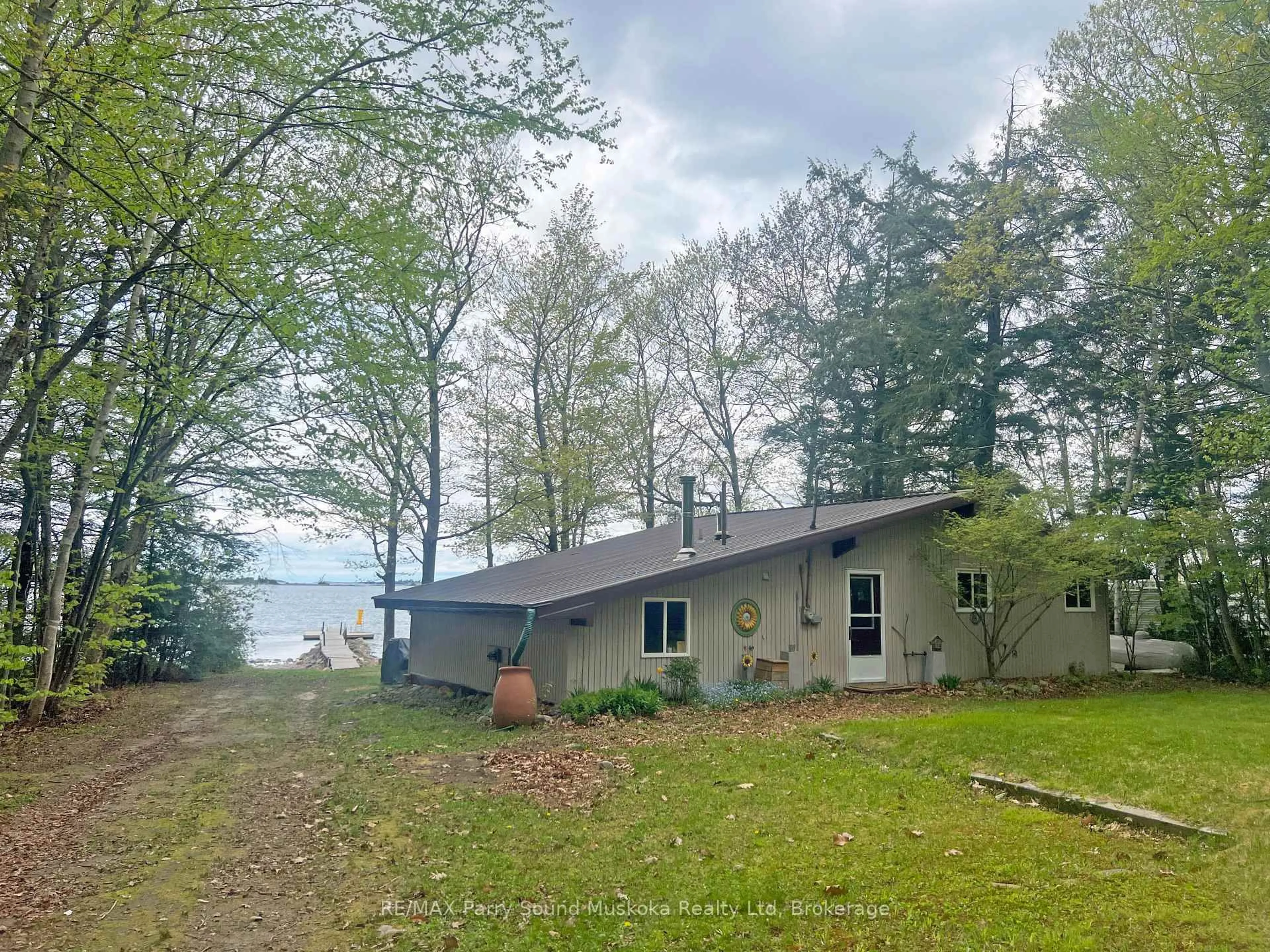 A pic from outside/outdoor area/front of a property/back of a property/a pic from drone, water/lake/river/ocean view for 400 (Lot 1) Oak Point Rd, Parry Sound Ontario P2A 2X4