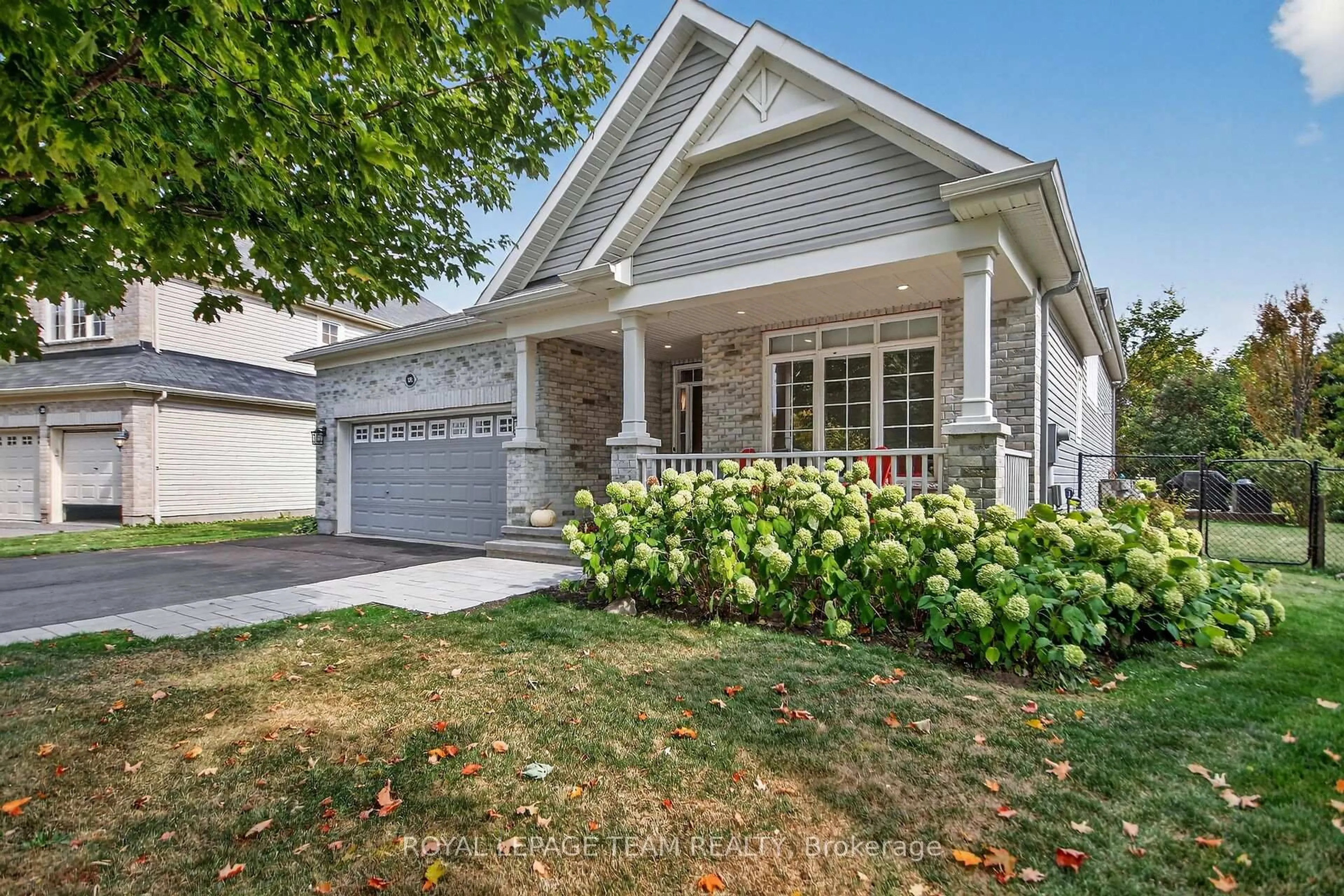 Home with vinyl exterior material, street for 128 Chenoa Way, Ottawa Ontario K2J 0M2