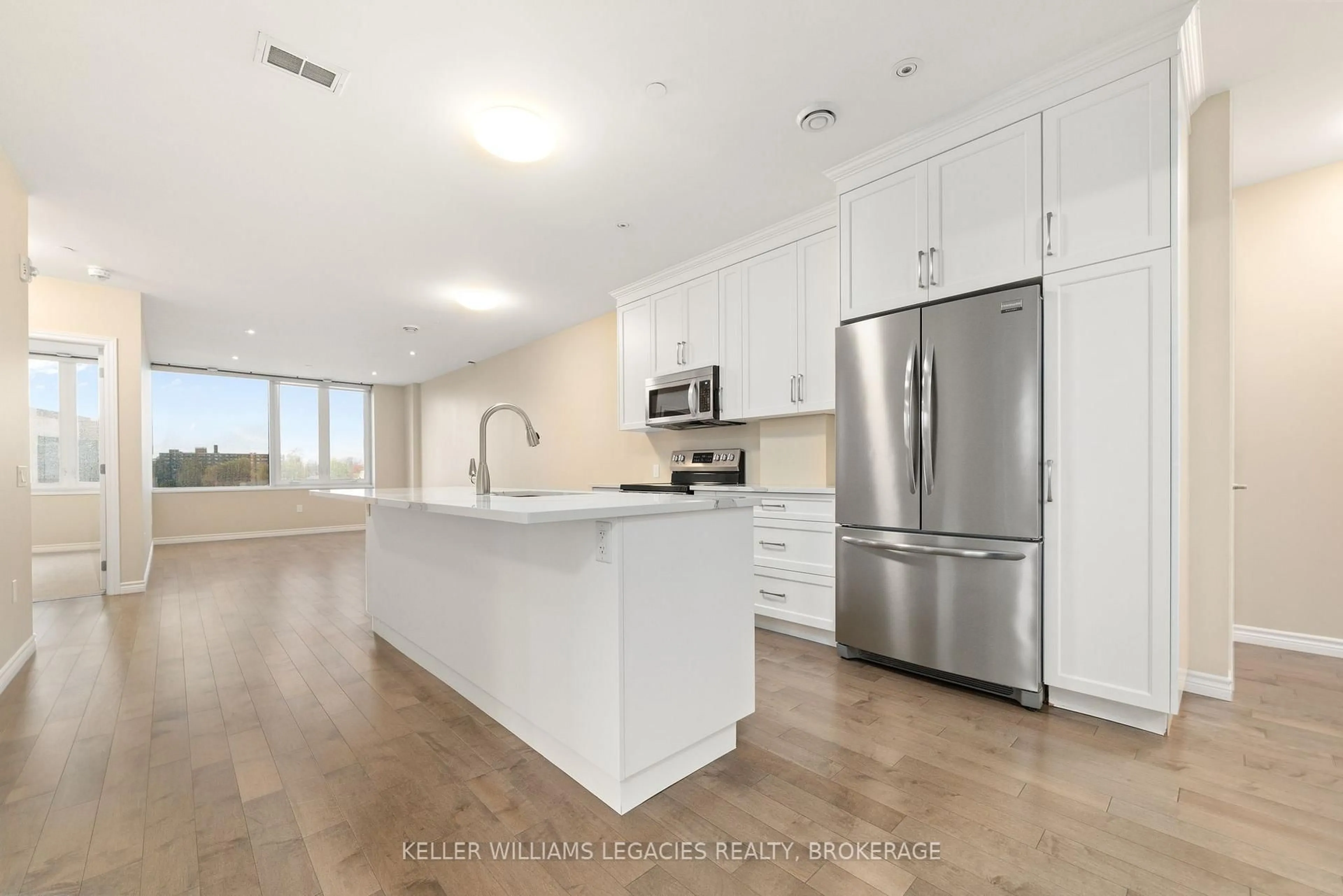 Open concept kitchen, wood/laminate floor for 199 Front St #510, Belleville Ontario K8N 5H5
