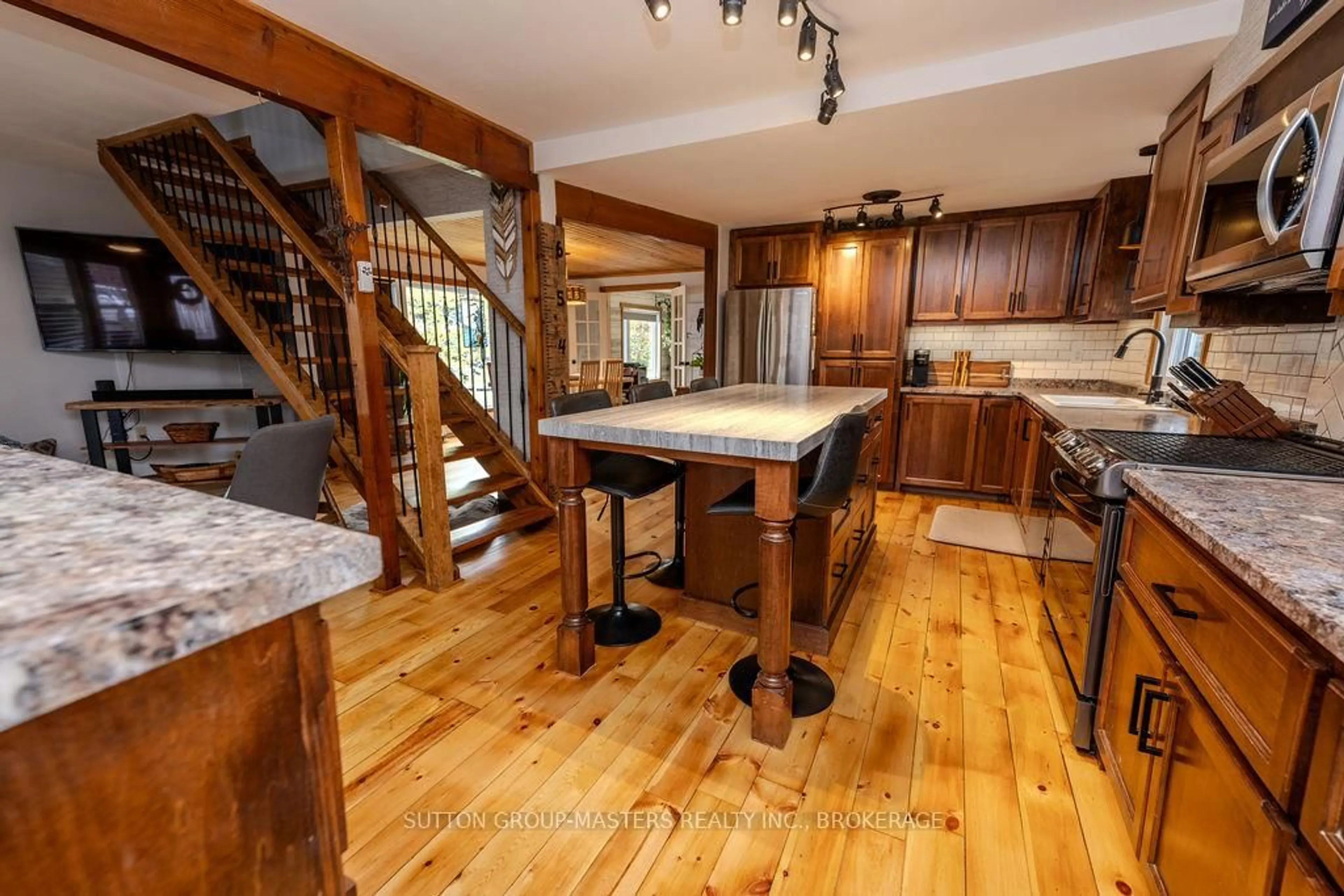 Open concept kitchen, wood/laminate floor for 772 Stephentown Lane, Kingston Ontario K7L 4V3