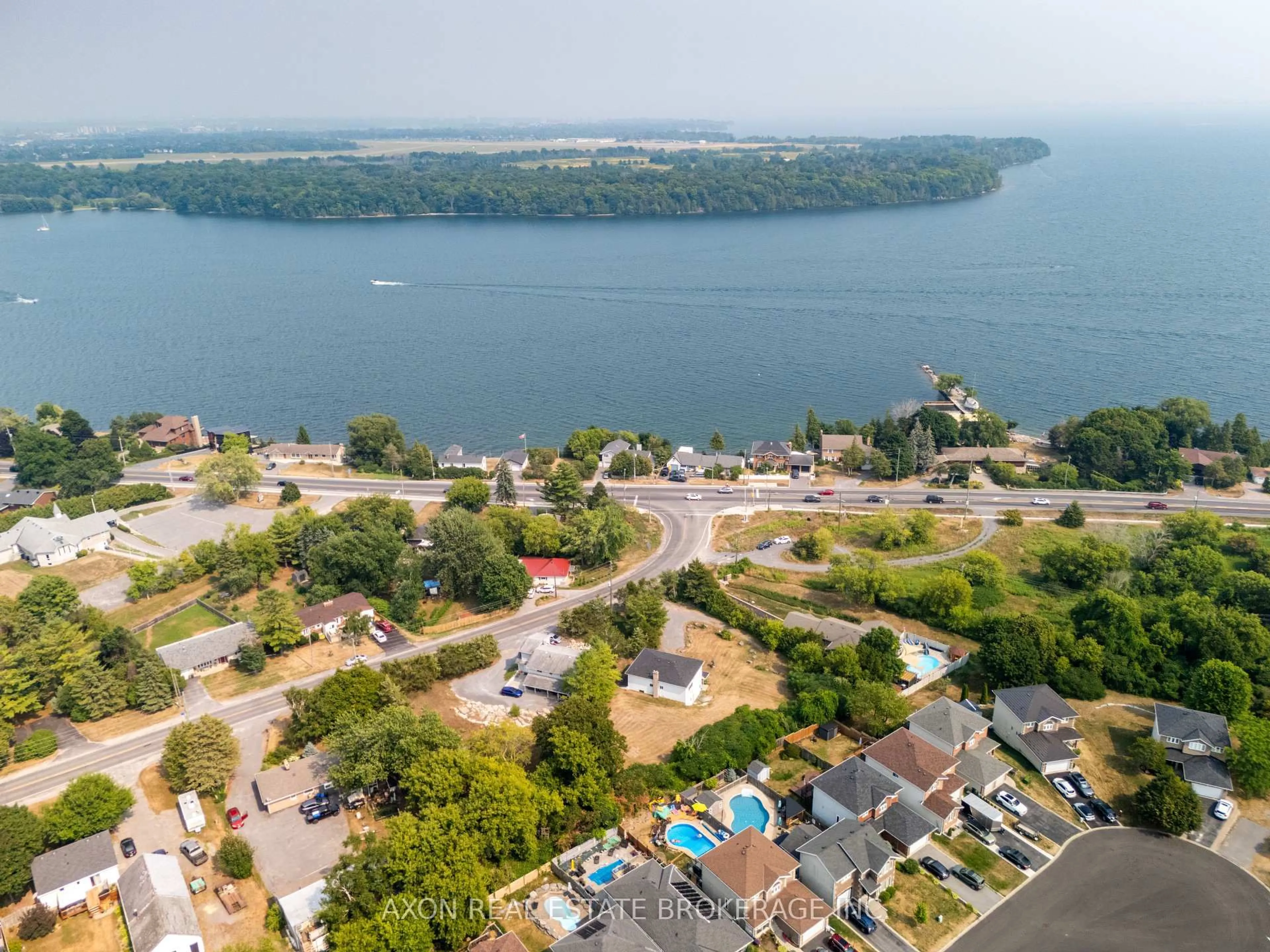 A pic from outside/outdoor area/front of a property/back of a property/a pic from drone, water/lake/river/ocean view for 300-302 Coronation Blvd, Amherstview Ontario K7M 5P9