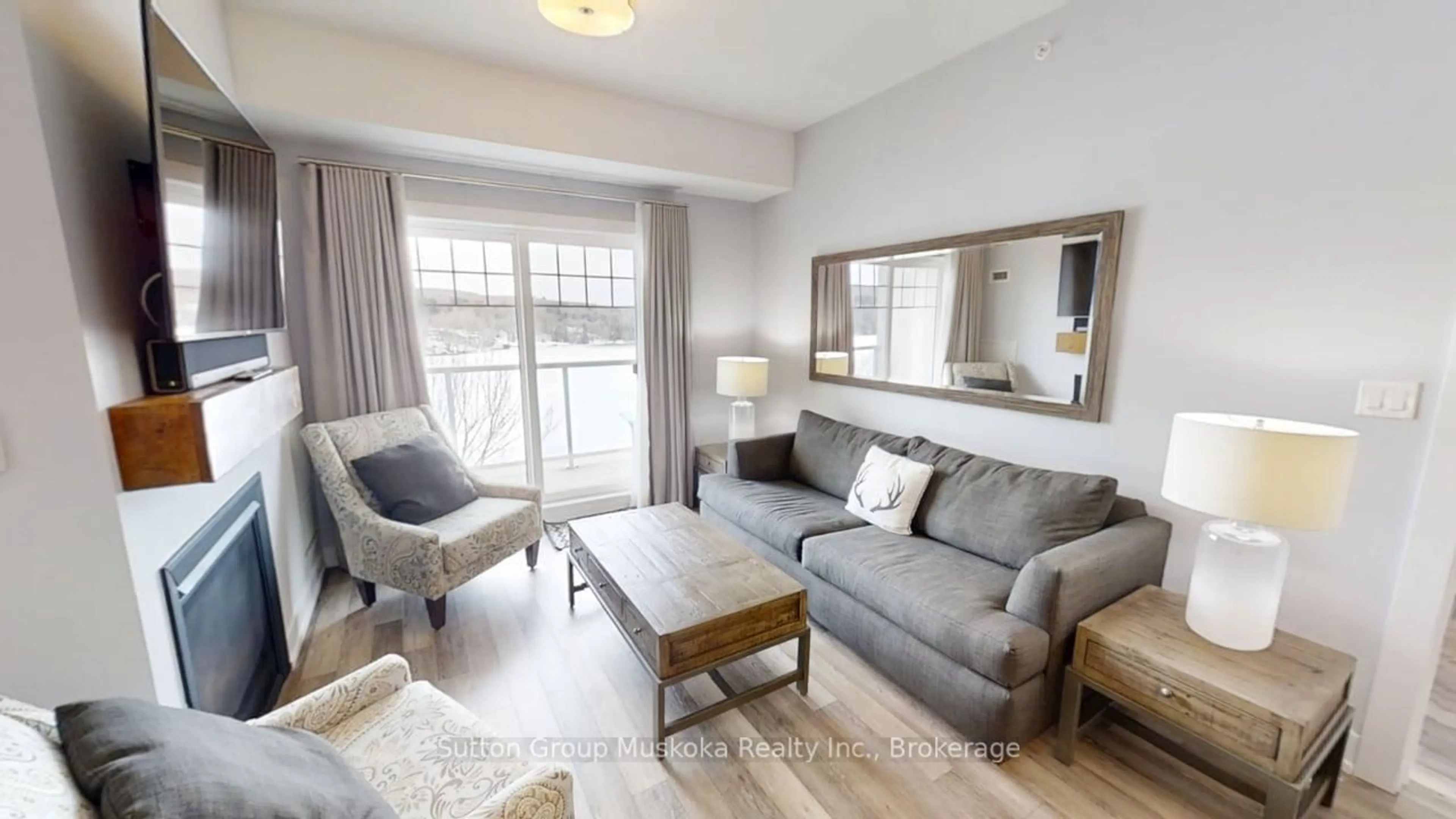 Living room with furniture, wood/laminate floor for 25 Pen Lake Point Rd #423, Huntsville Ontario P1H 2E8