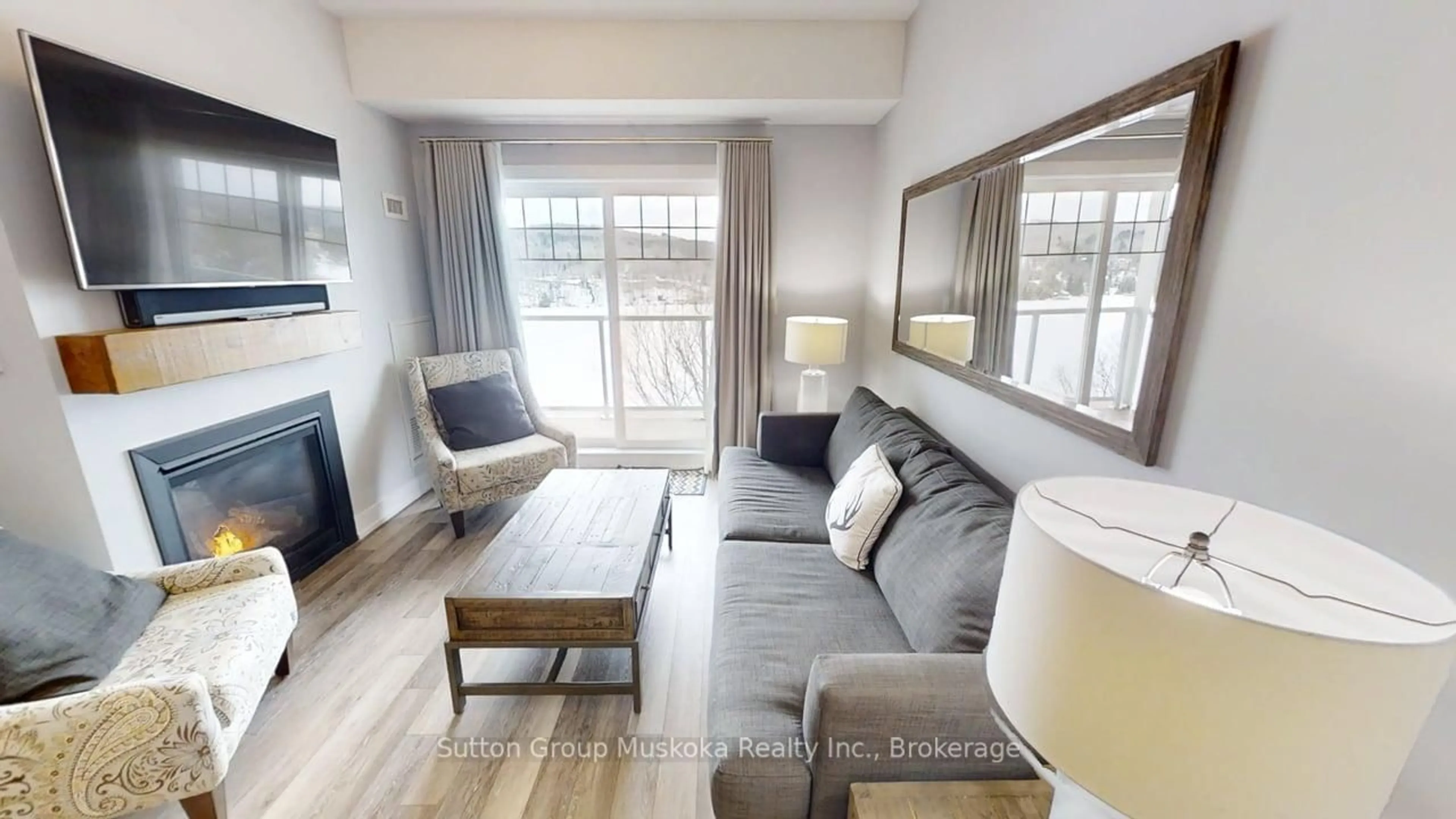 Living room with furniture, wood/laminate floor for 25 Pen Lake Point Rd #423, Huntsville Ontario P1H 2E8