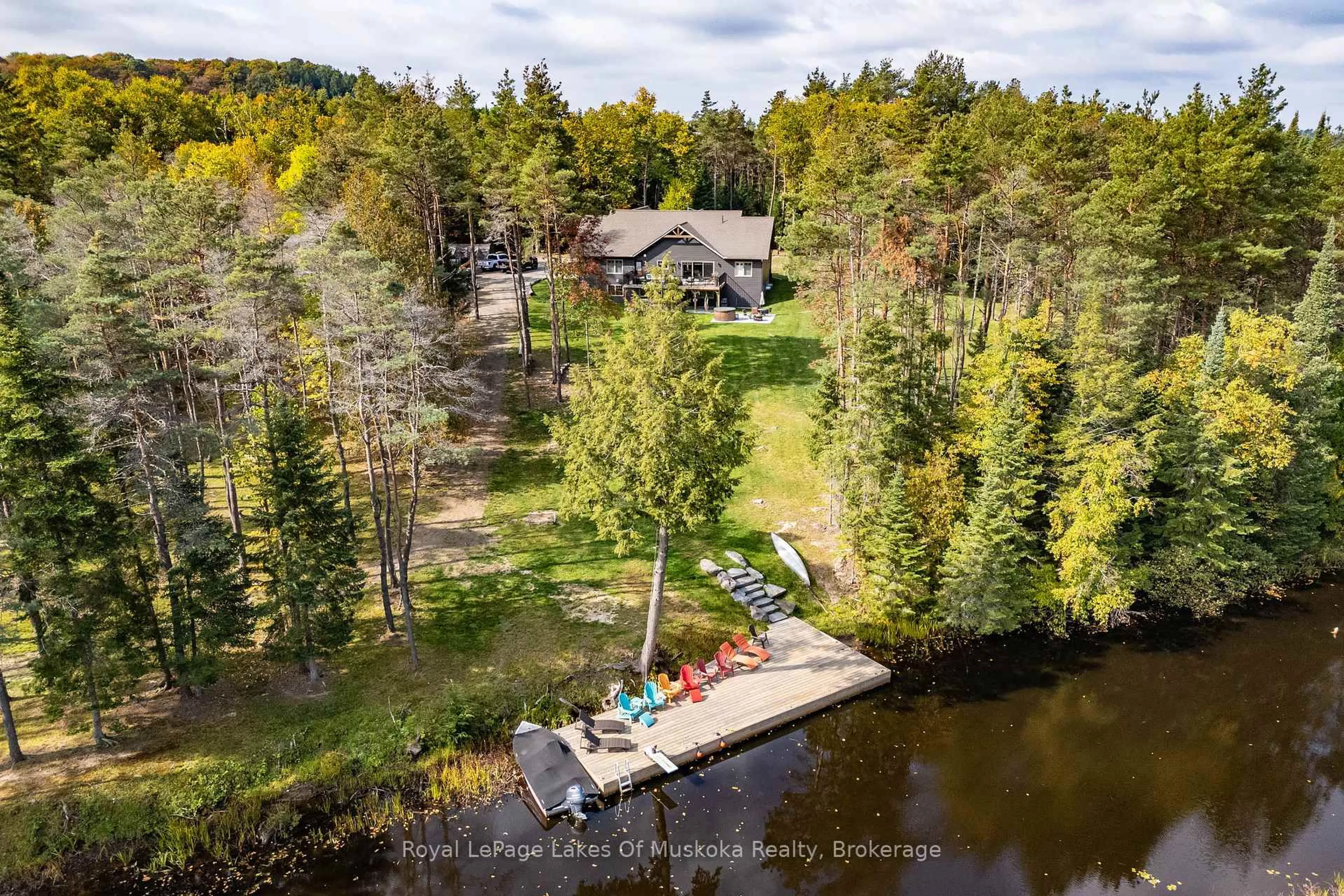 A pic from outside/outdoor area/front of a property/back of a property/a pic from drone, water/lake/river/ocean view for 461 Rowanwood Rd, Huntsville Ontario P0B 1M0
