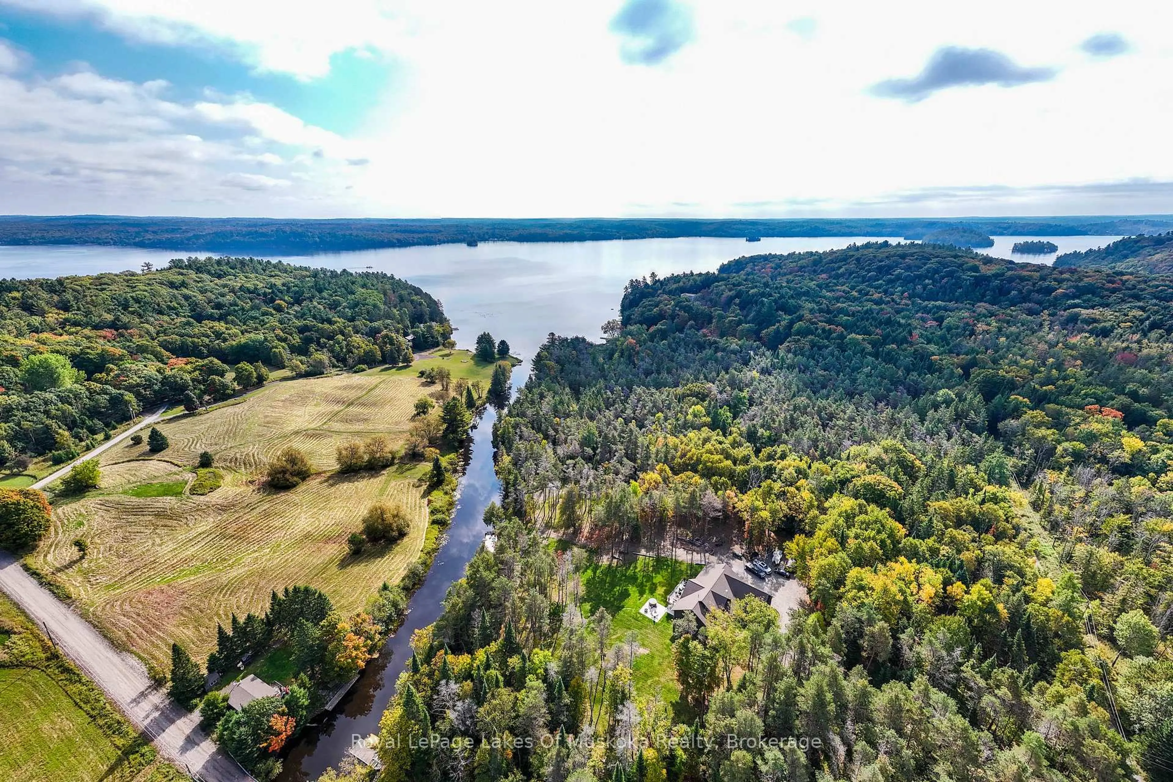 A pic from outside/outdoor area/front of a property/back of a property/a pic from drone, water/lake/river/ocean view for 461 Rowanwood Rd, Huntsville Ontario P0B 1M0