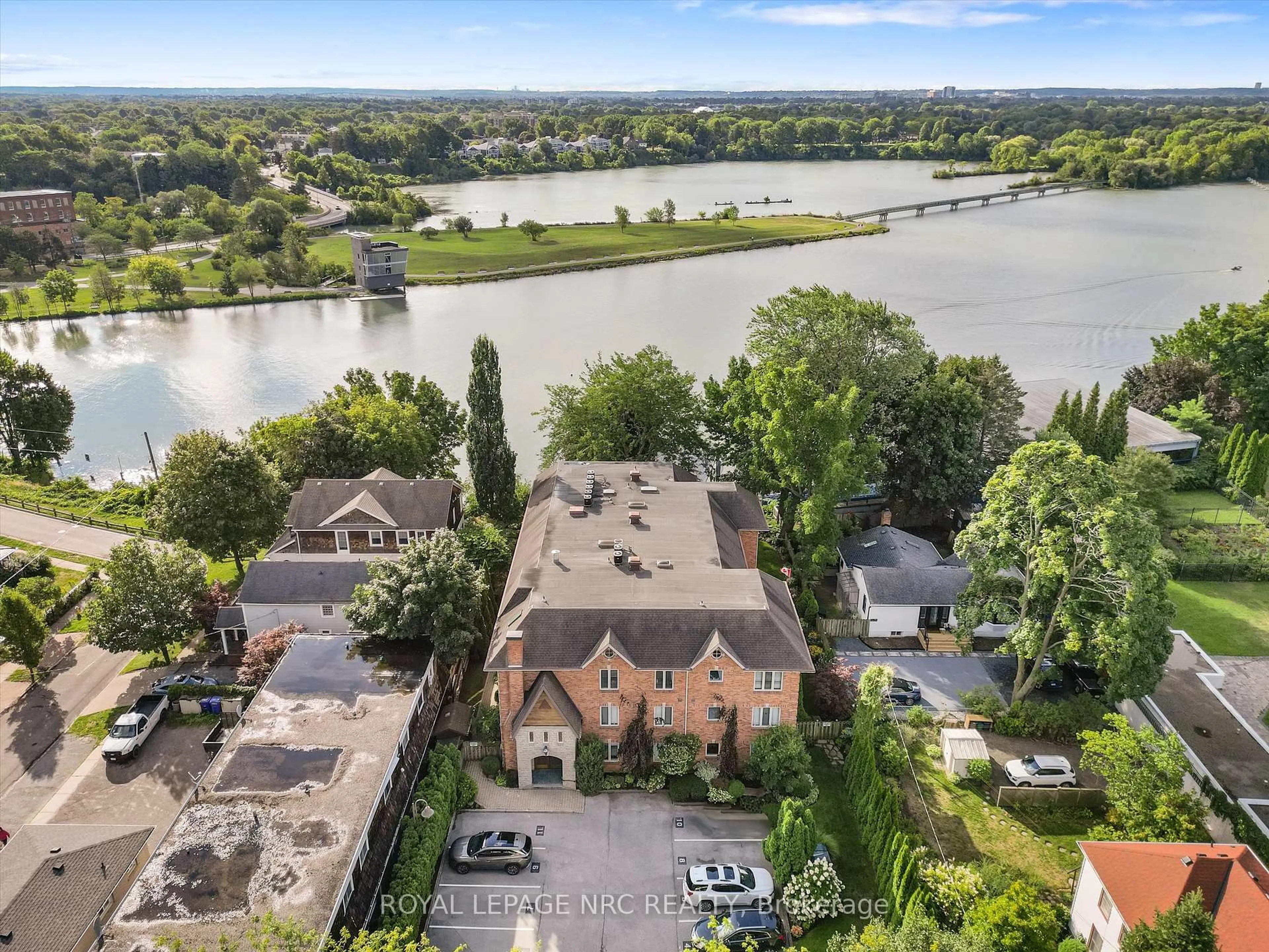 A pic from outside/outdoor area/front of a property/back of a property/a pic from drone, water/lake/river/ocean view for 55 Main St #101, St. Catharines Ontario L2N 4T8