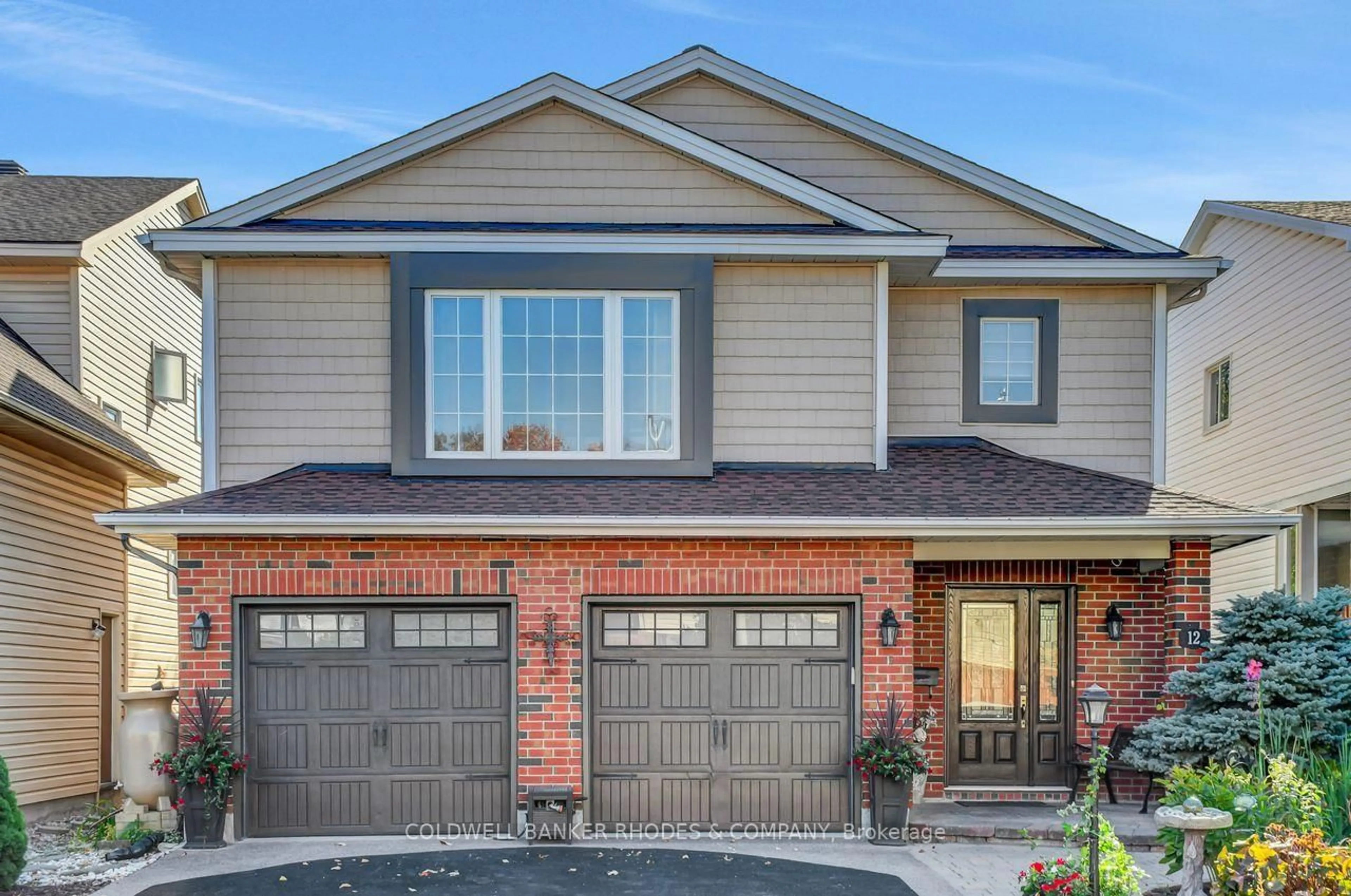 Home with brick exterior material, street for 12 Bramblegrove Cres, Ottawa Ontario K1T 3G3