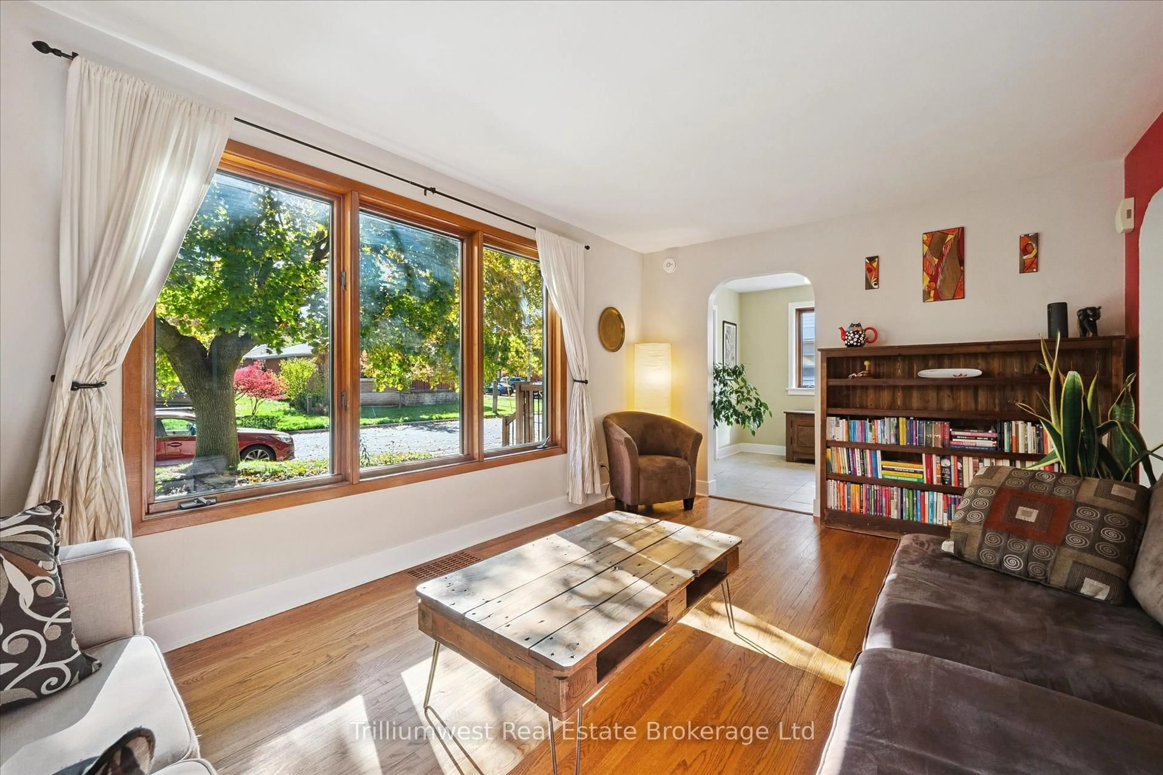 Living room with furniture, wood/laminate floor for 4 Balsarroch Pl, Guelph Ontario N1E 3J5